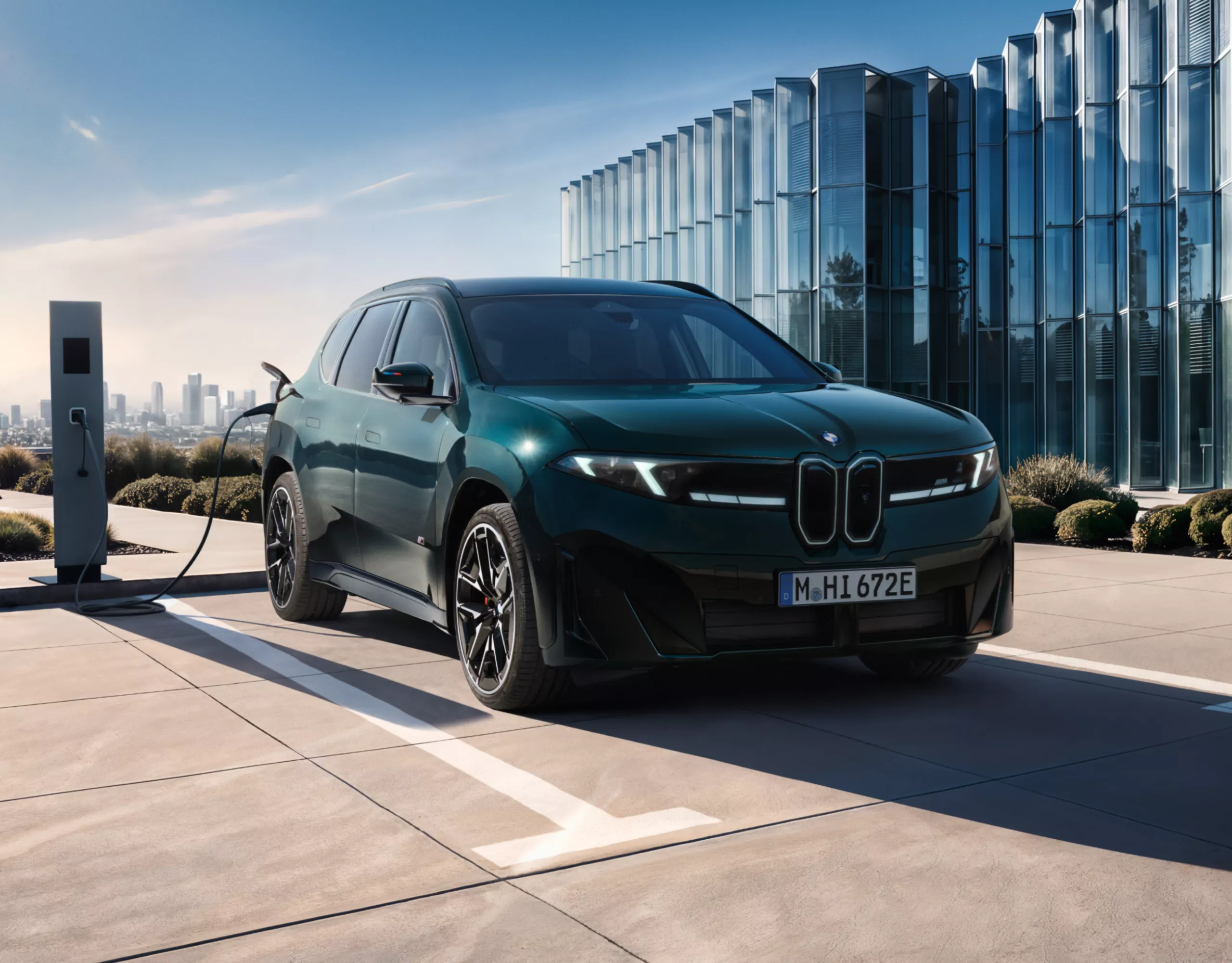 BMW iX3 M60 xDrive is being charged at a charging station