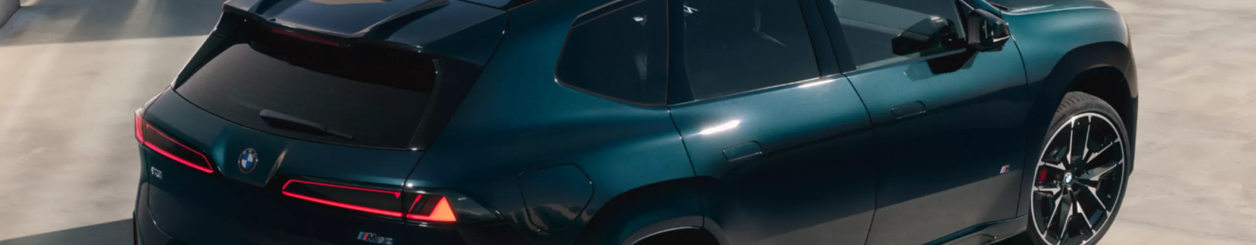 BMW iX3 M60 xDrive with panoramic glass sunroof with climate comfort glass extending to the rear