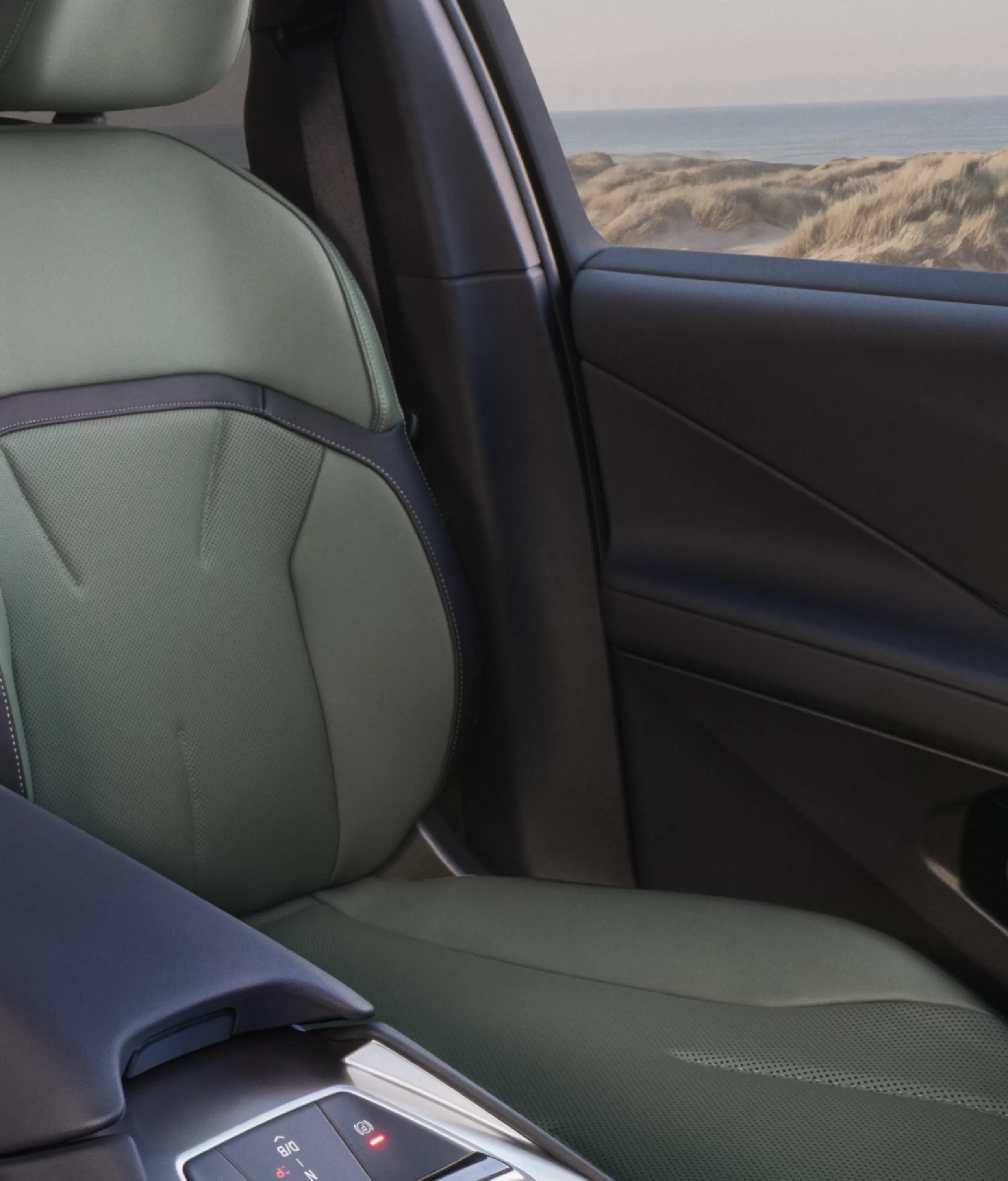 Seats in the BMW iX4 50 xDrive interior with premium material appearance.