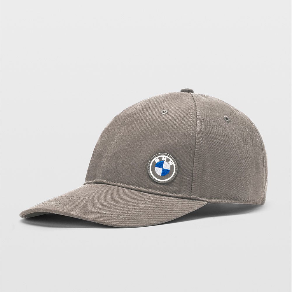 BMW Lifestyle turquoise BMW M shirt with white BMW M Logo, turquoise BMW M baseball cap and turquoise BMW M bath towel worn by a young man