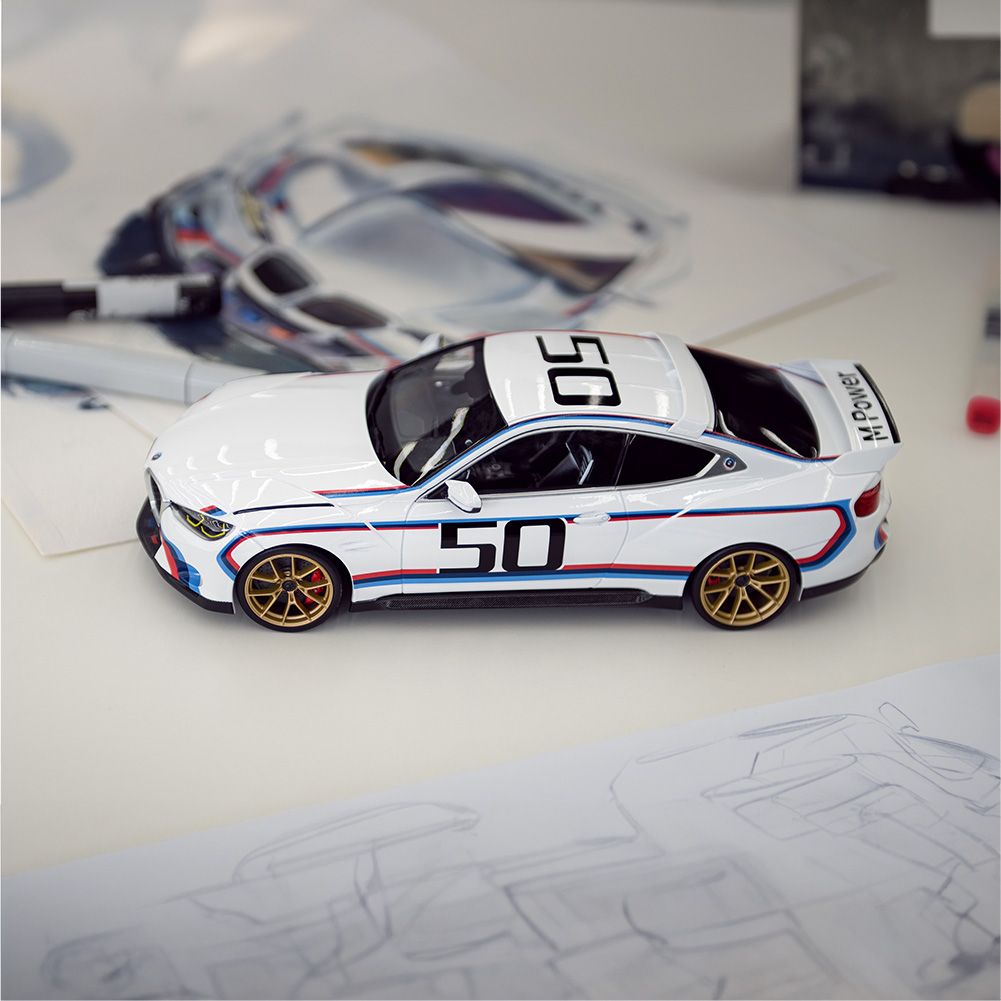 BMW Lifestyle BMW Miniatures featuring a BMW M3 E30, BMW M1, and BMW 3 Series E30 in a miniature setting 