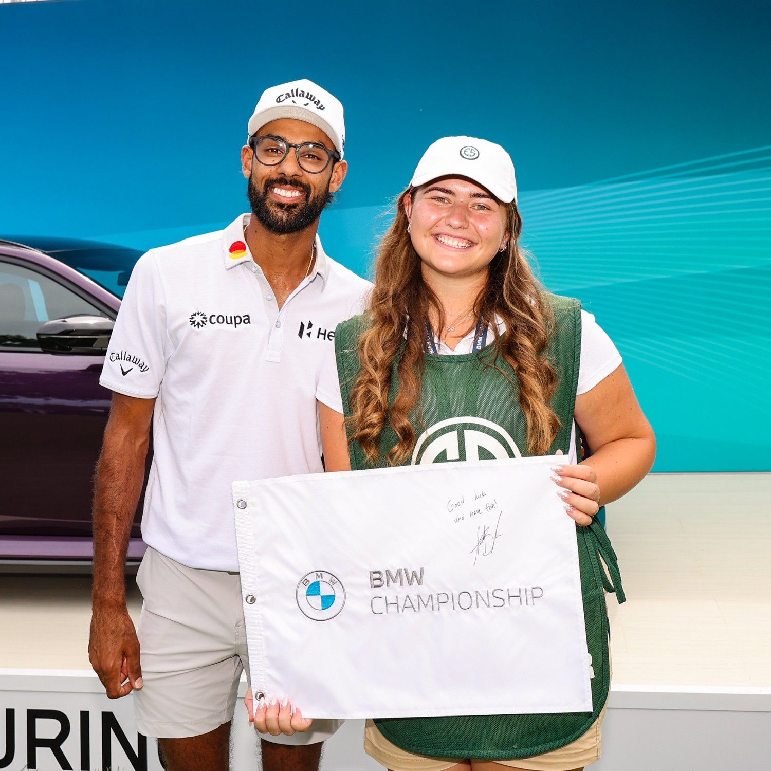 Akshay Bhatia poses with Evans Scholarship recipient Juliya Tabaka