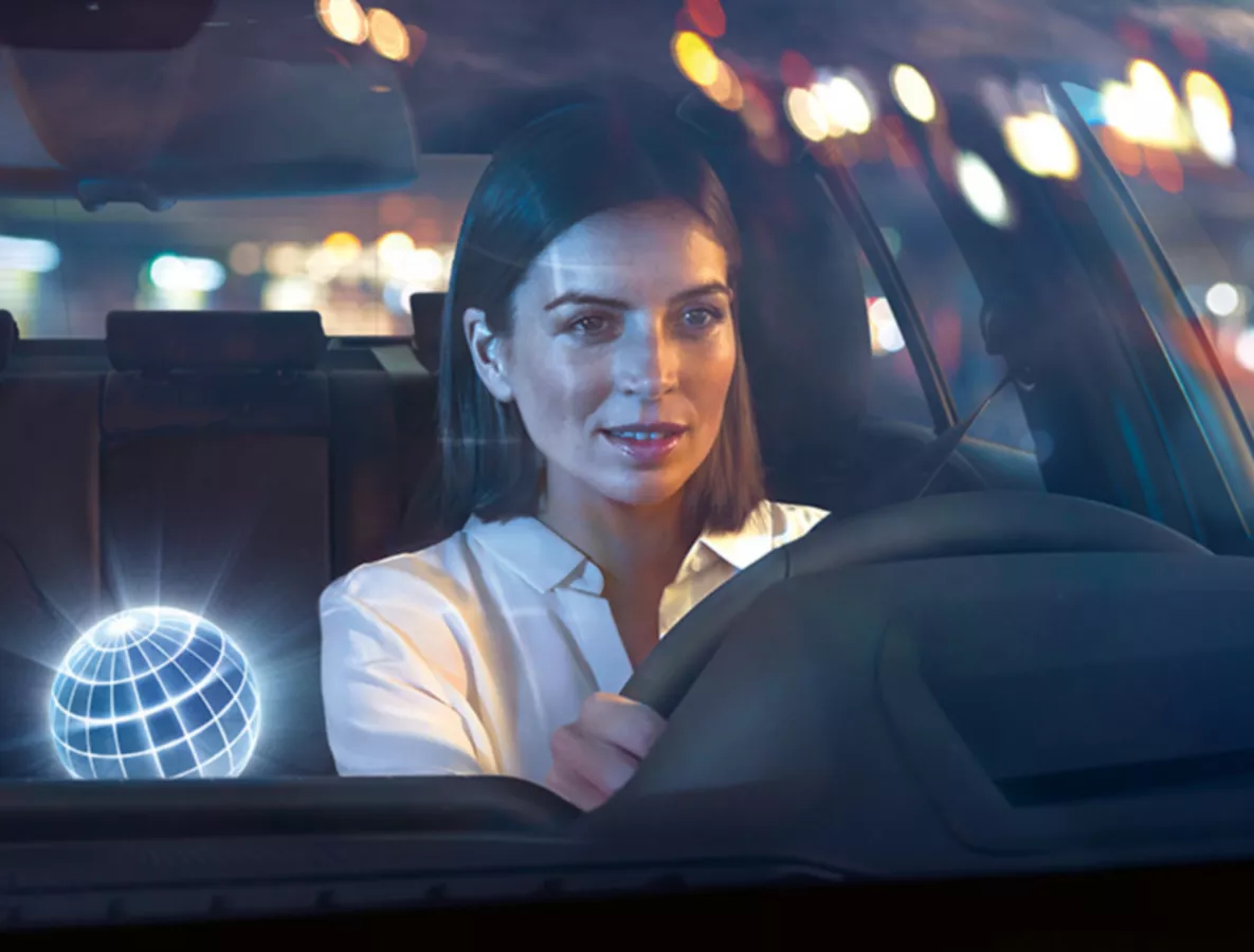 BMW Corporate sales services BMW Connected Drive for business clients female driver.
