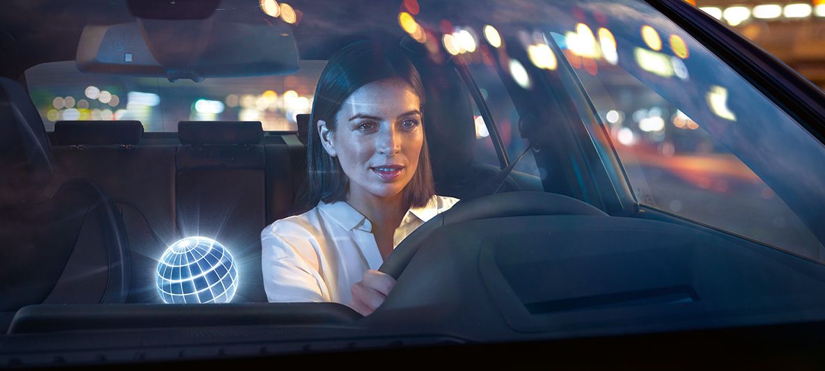 BMW Corporate sales services BMW Connected Drive for business clients female driver.