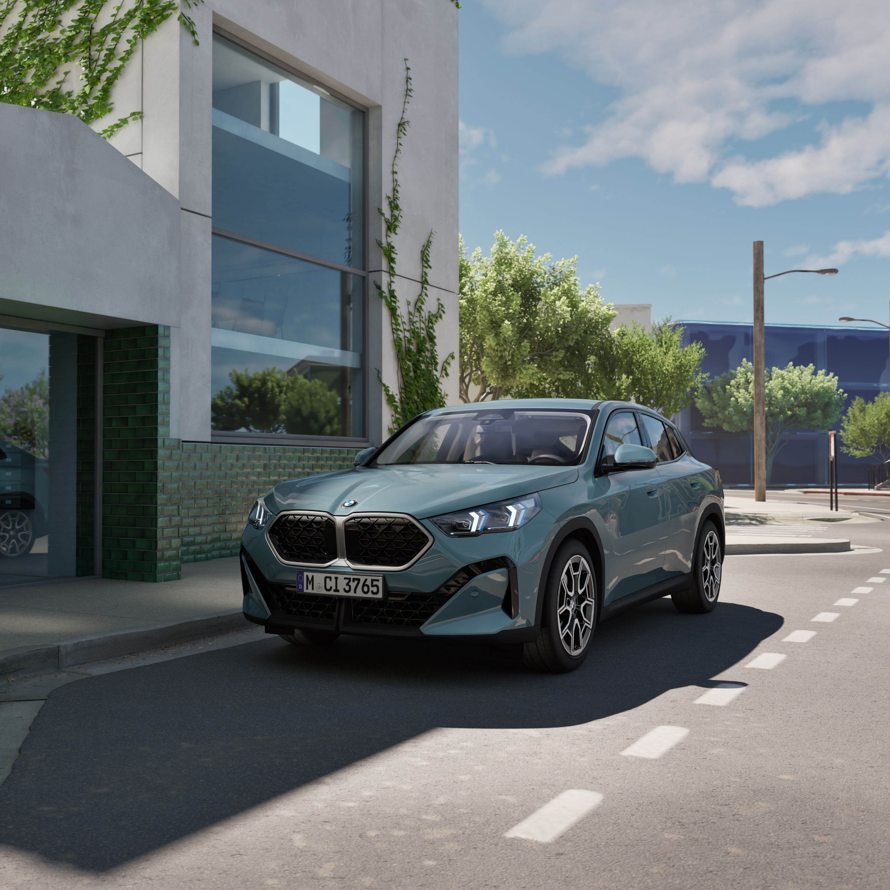 BMW X2 U10 SUV in front of a modern building in the centre of a city
