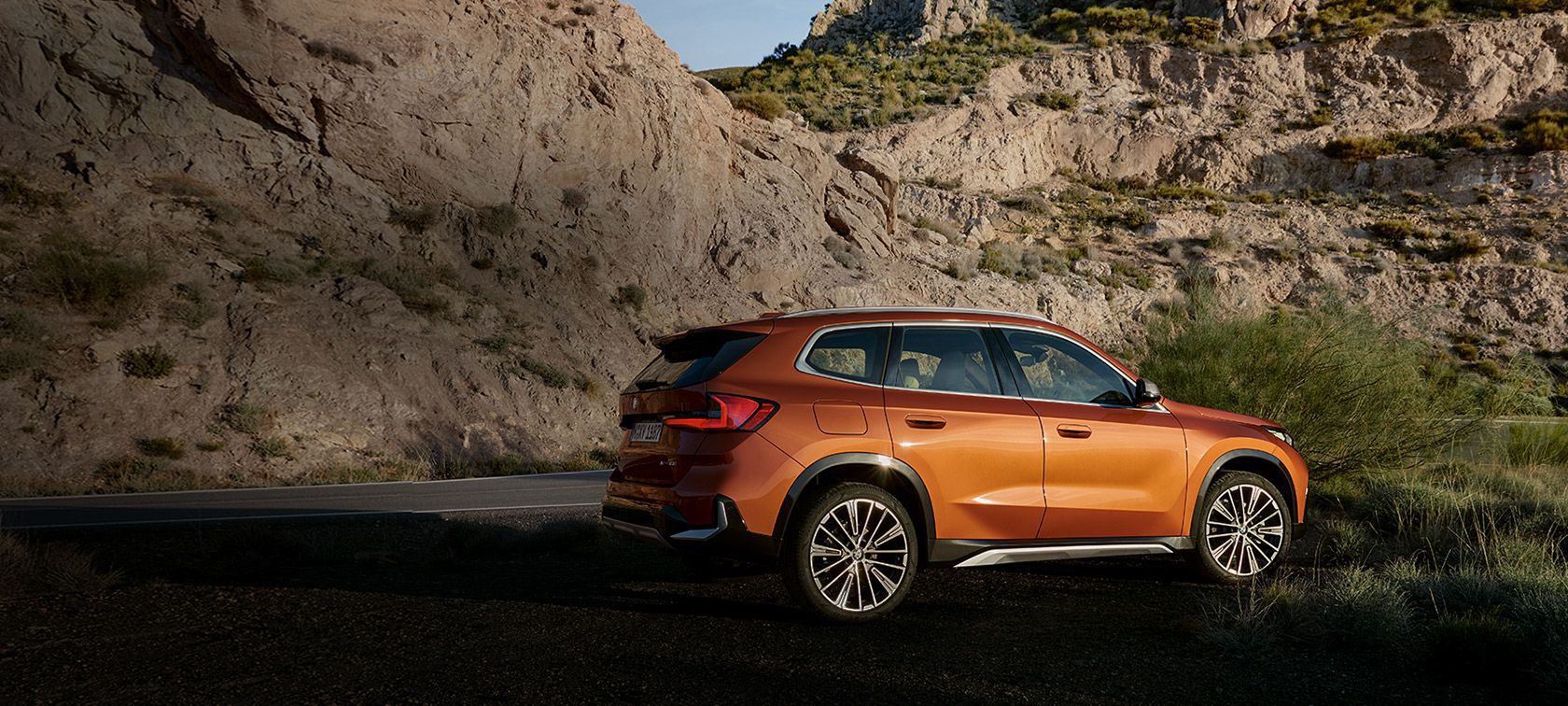 BMW X1 U11 xLine Utah orange metallic vue de trois quarts avant