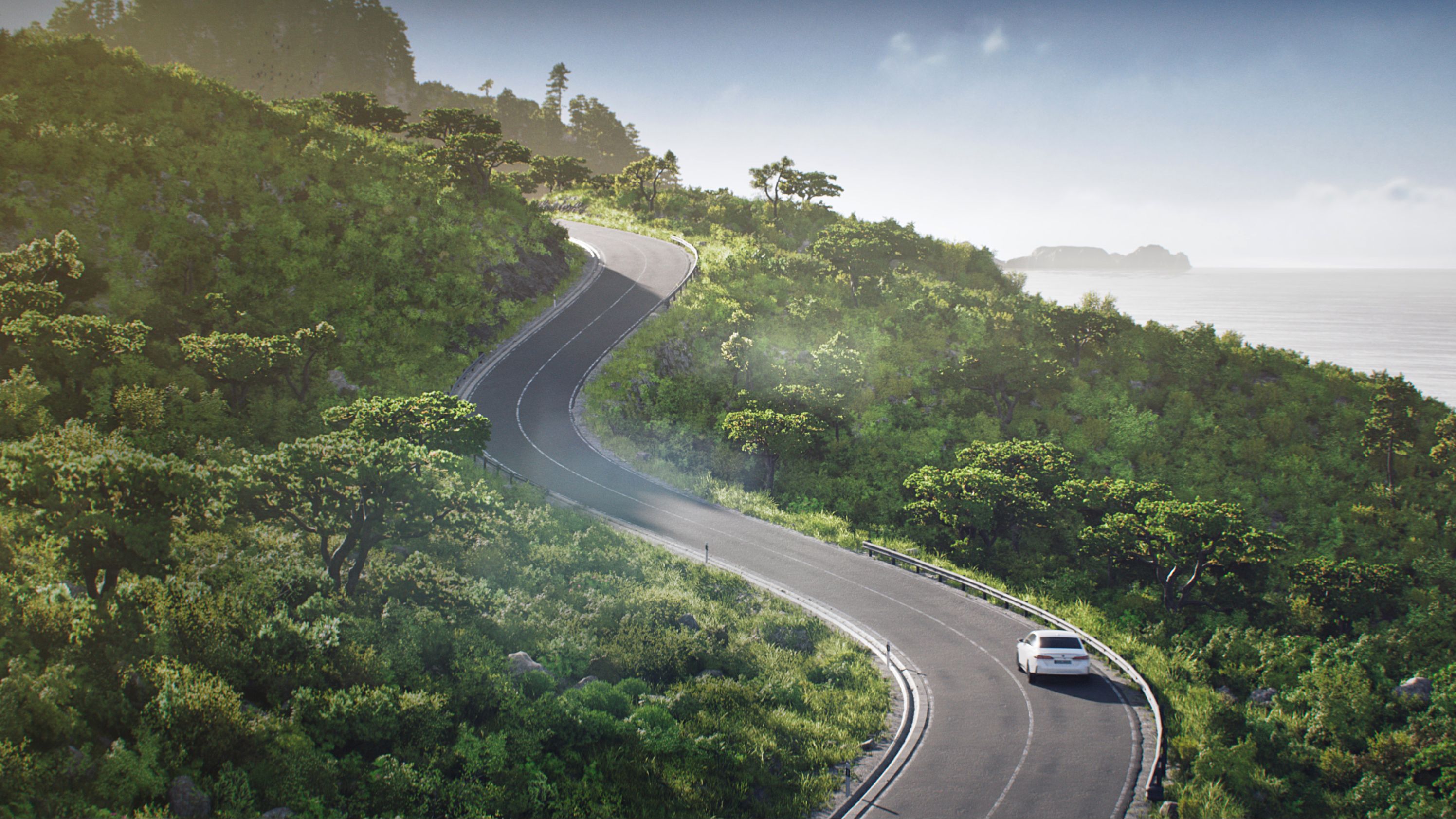 Μοντέλα BMW i, κόμβος βιωσιμότητας – καθαρός, ανηφορικός δρόμος με στροφές μέσα από δασώδη περιοχή, κατά μήκος ακτής
