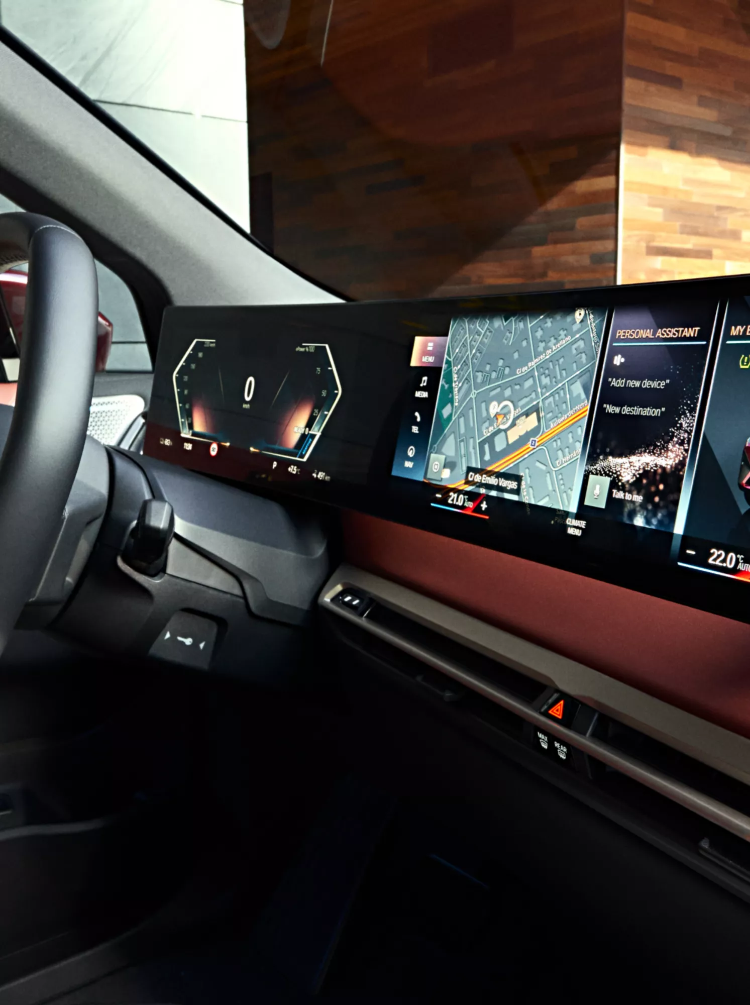 BMW cockpit with steering wheel and display showing a selection of digital services