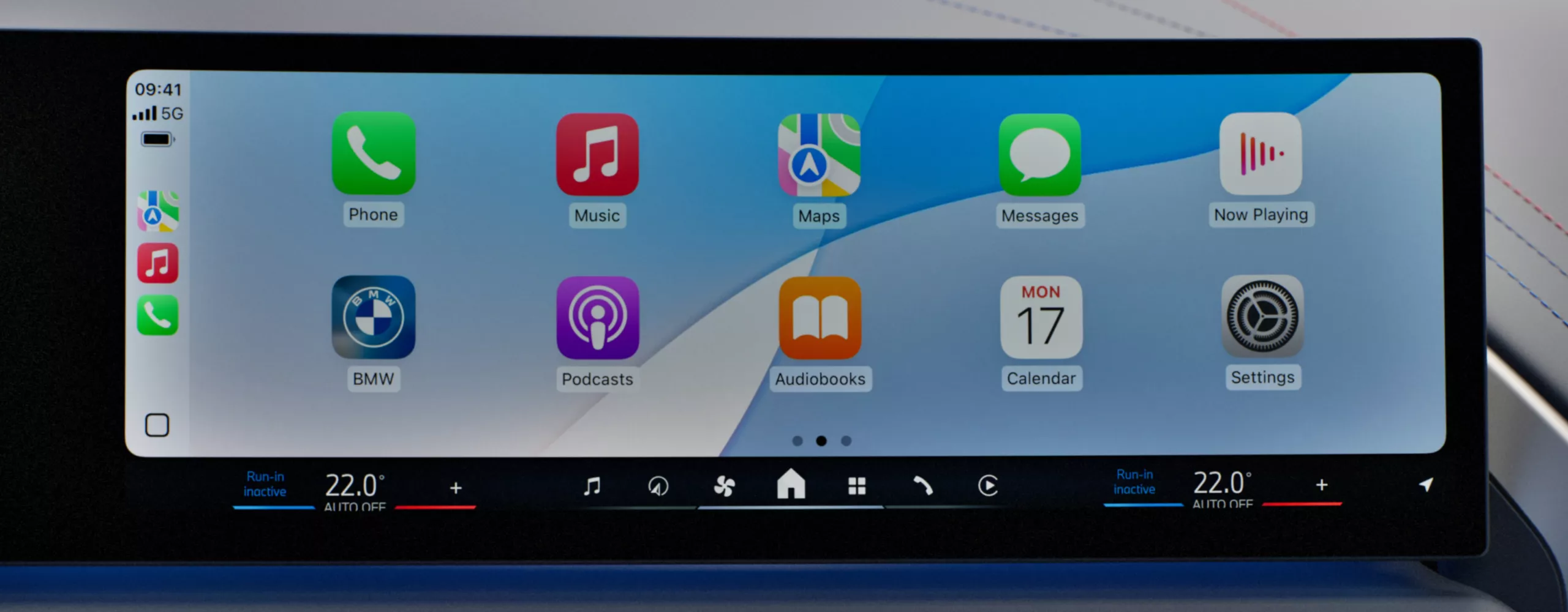 Smartphone apps are visible on the central display