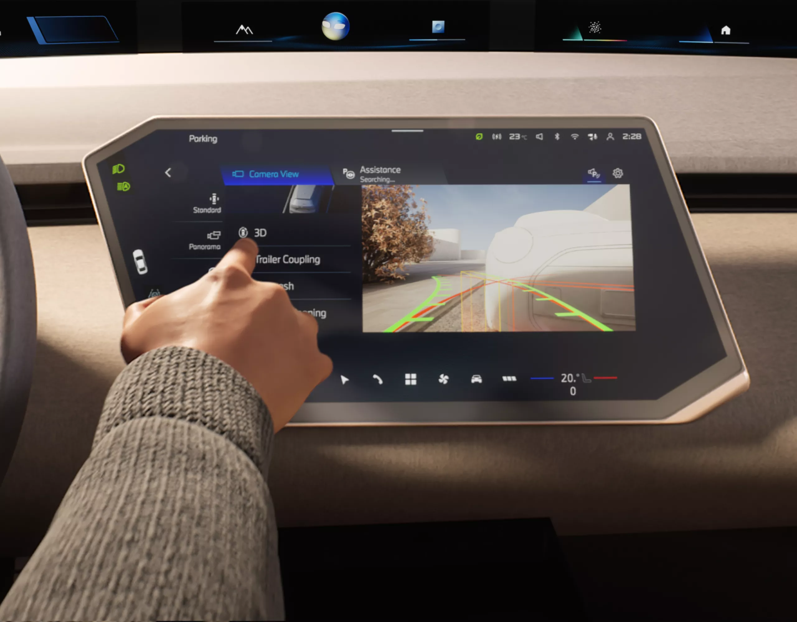 BMW cockpit with hand on steering wheel – display shows rear view camera view for improved parking and parking aid lines
