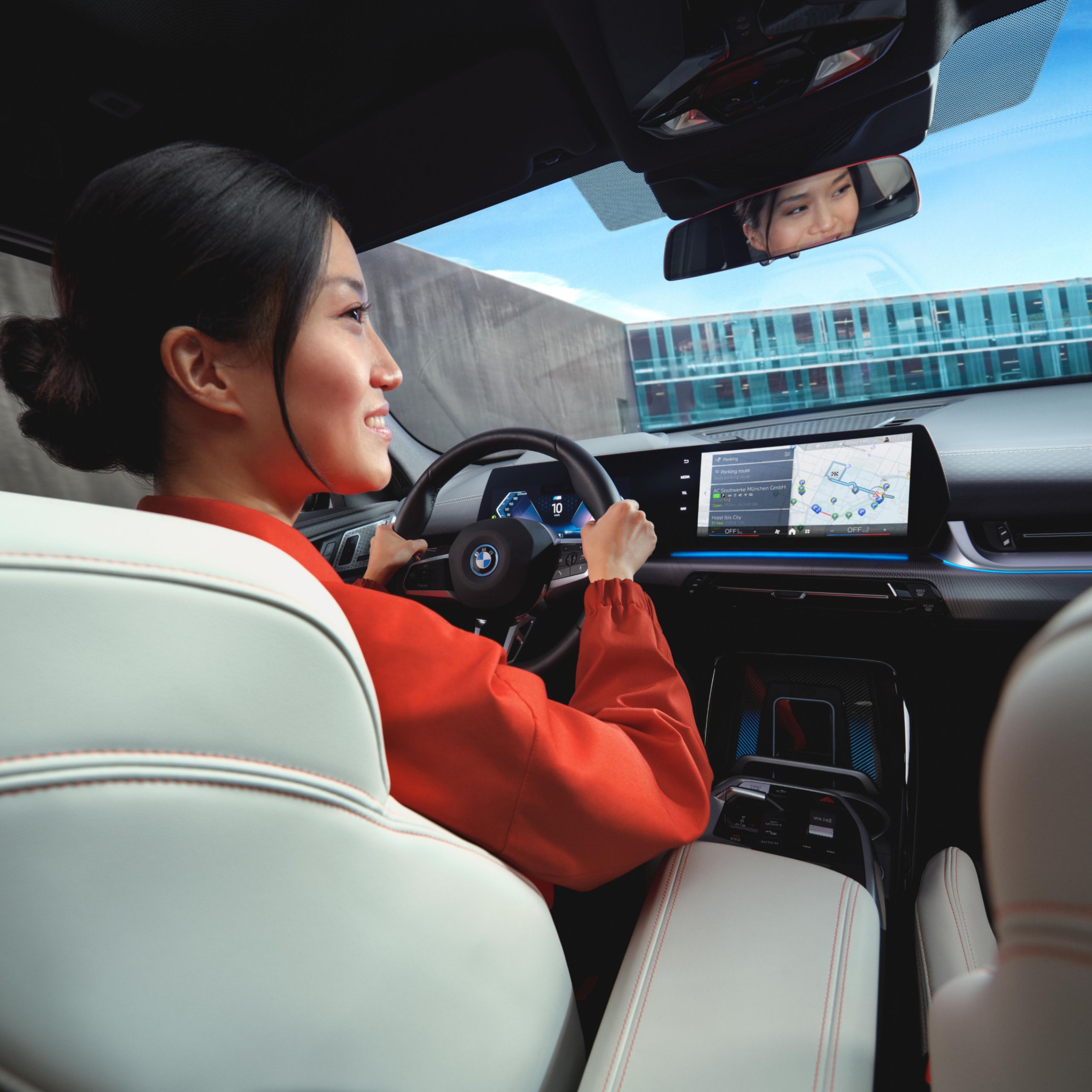 A person navigates a BMW