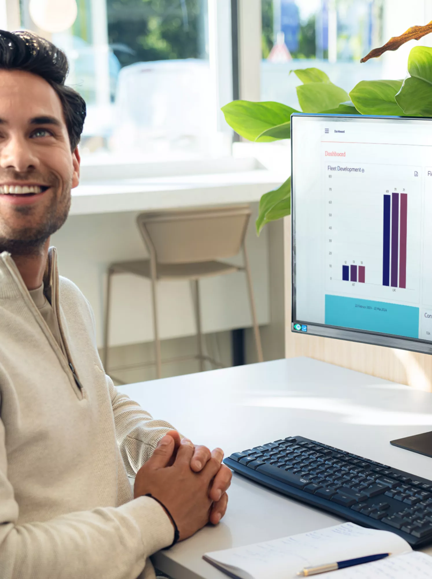 A person who has created graphics on a computer is conversing with someone outside the field of vision