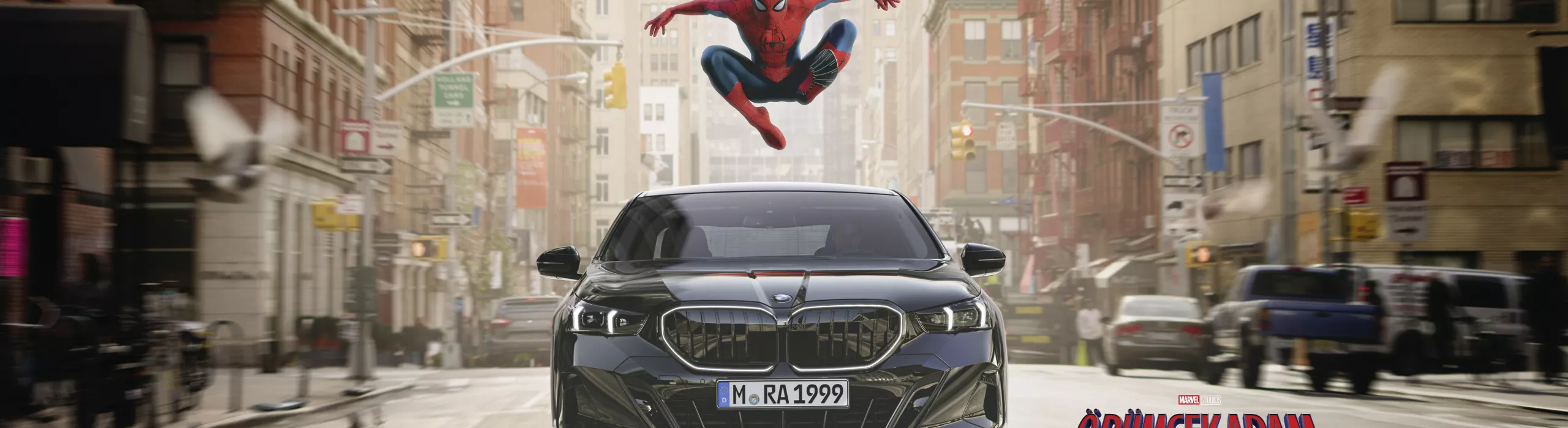 Spider-Man in a heroic pose above the BMW 5 Series.
