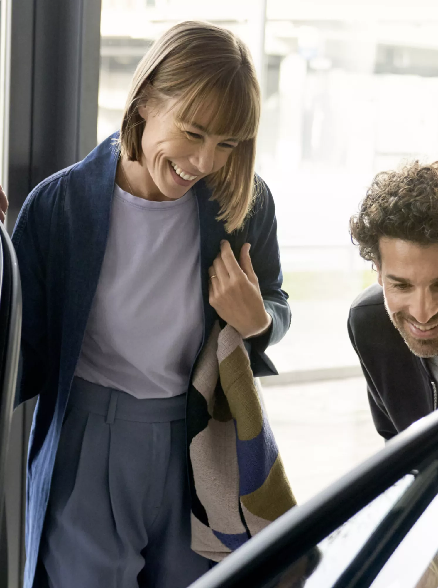 A family is looking at a BMW in a BMW dealership