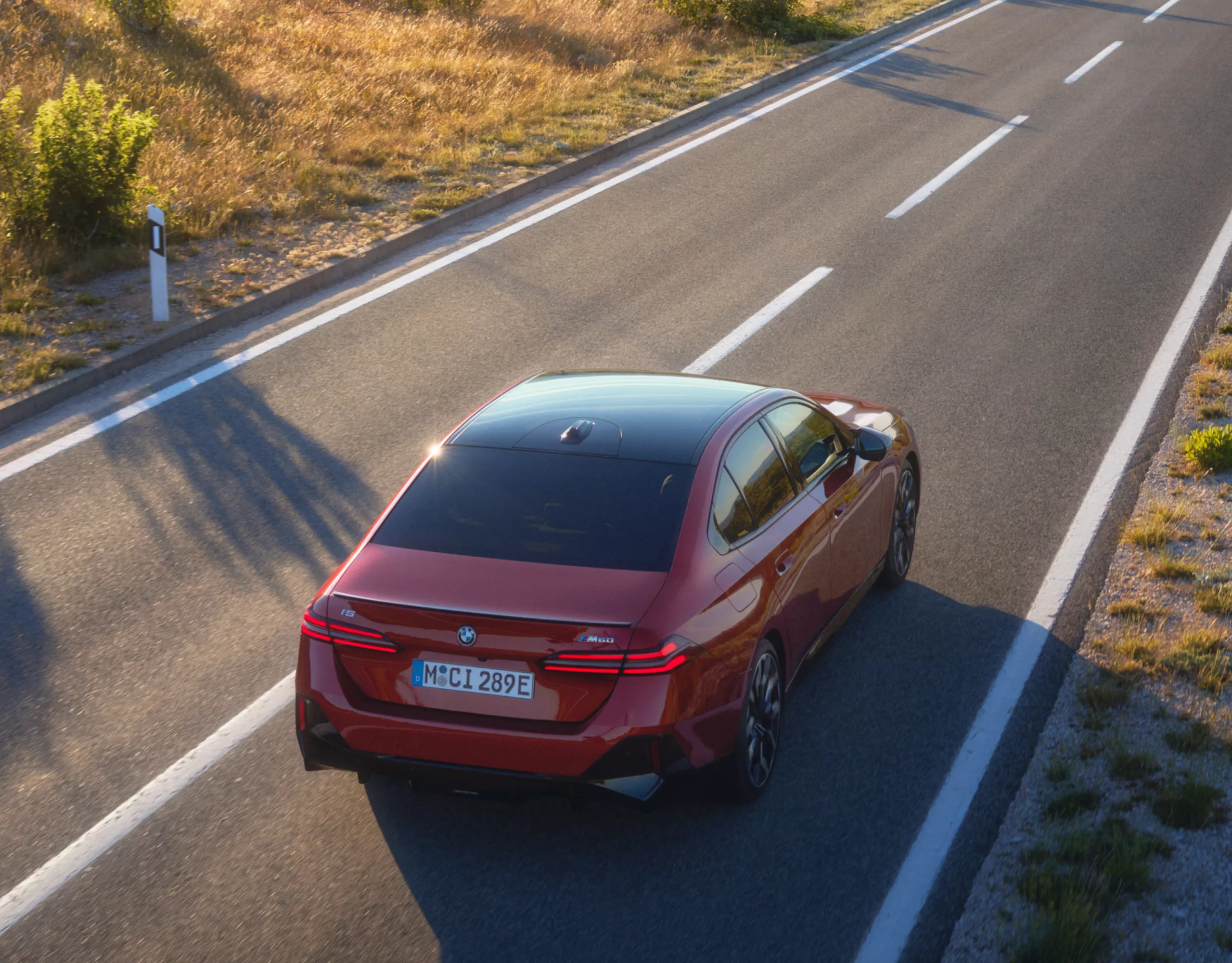 BMW i5 M60 xDrive sedan on a country road