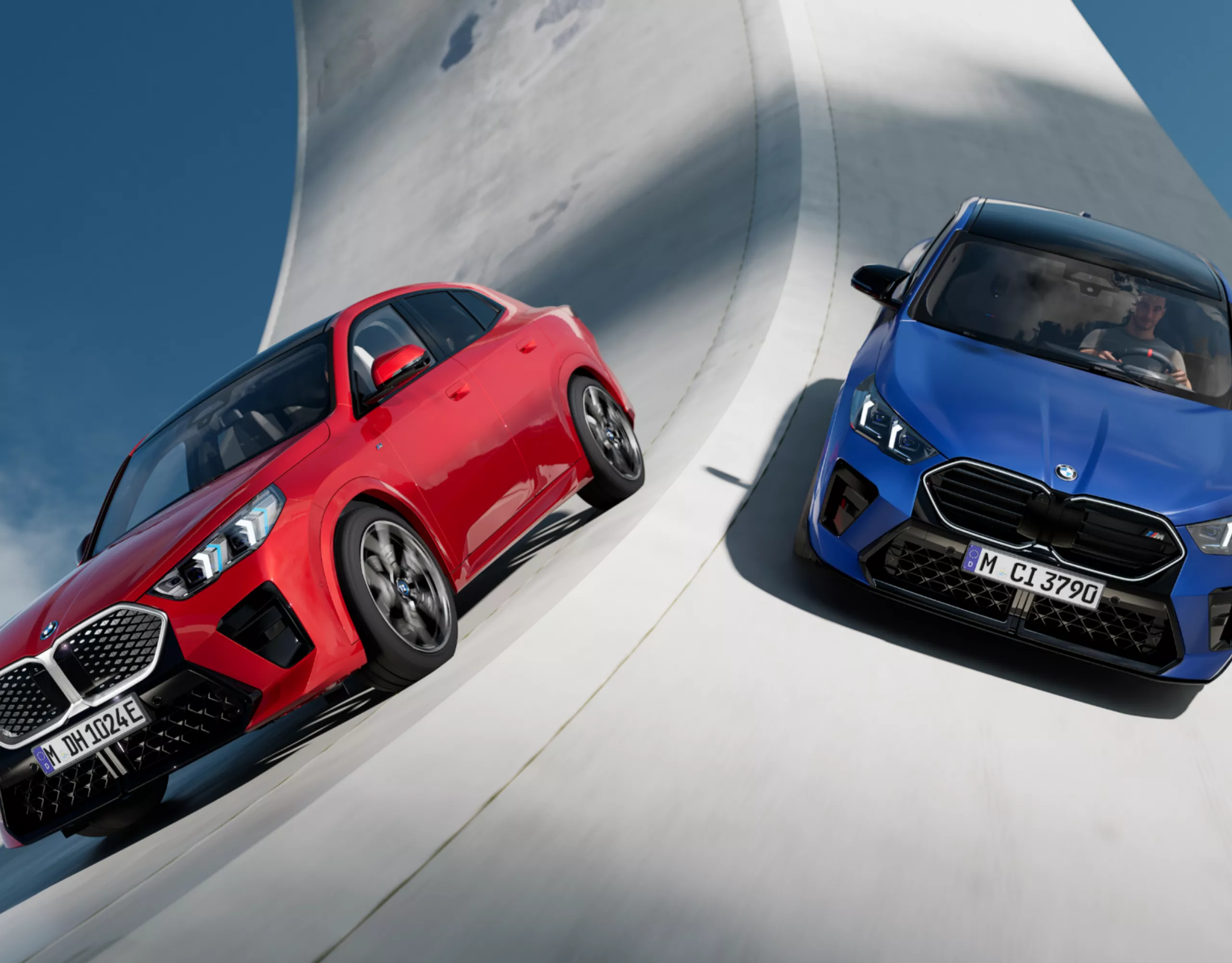 A red and a blue BMW drive down a surreal road