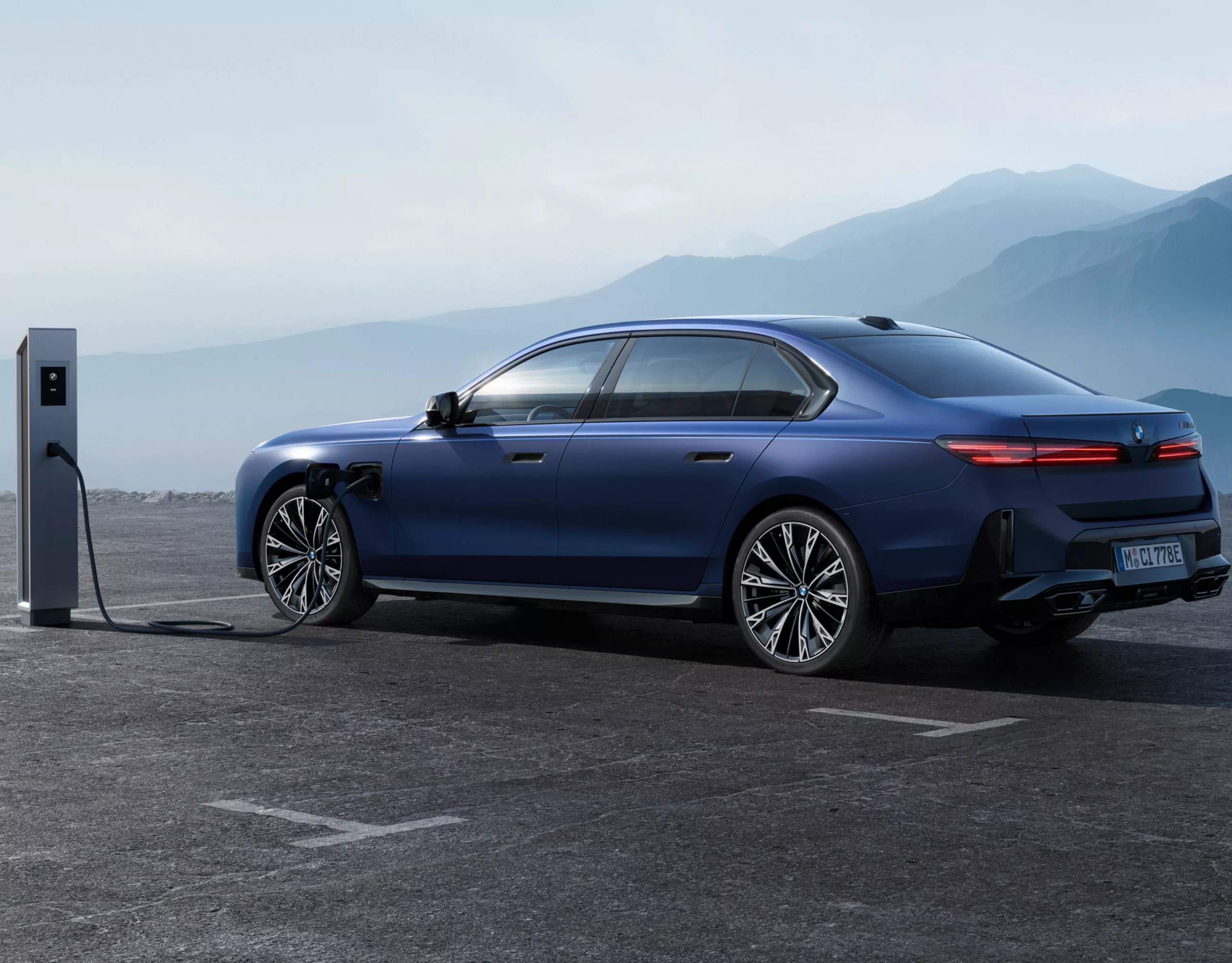 BMW 7 series plug-in hybrid vehicle connected to a charging station