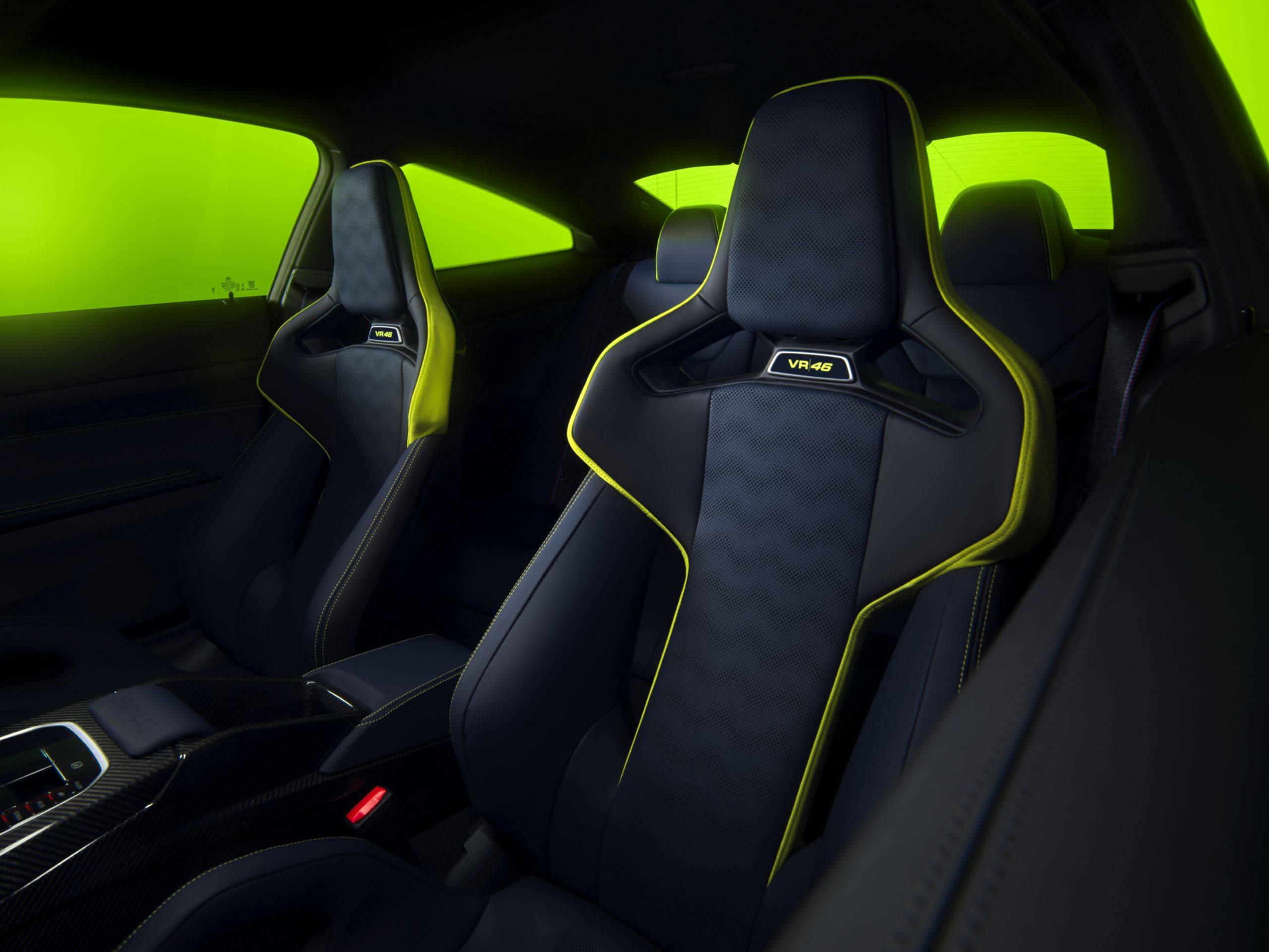 The interior of the BMW M4 CS VR46, including the M Carbon Fiber Bucket Seats with yellow trim.