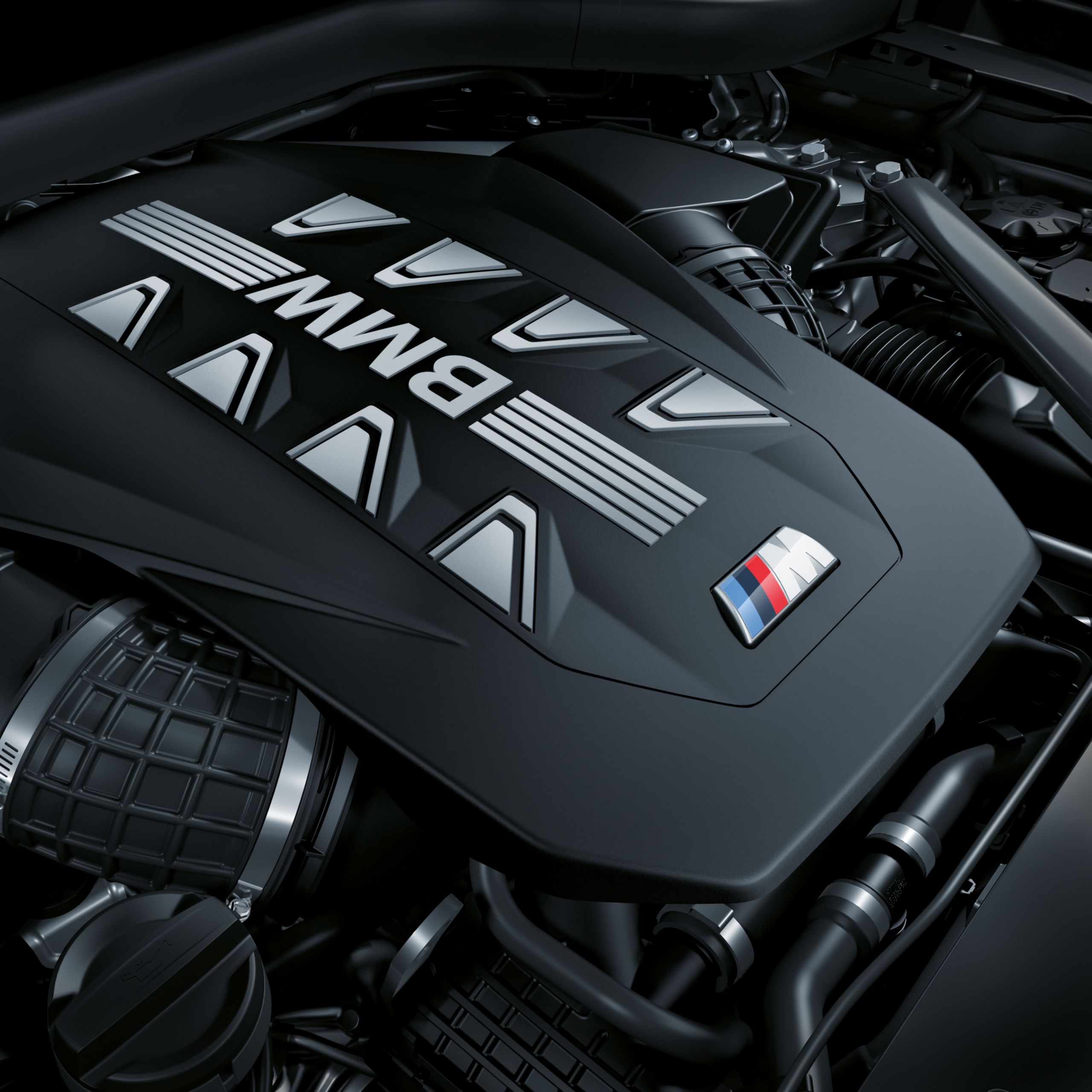 Motorafdekking van de BMW X6 M60i xDrive M TwinPower Turbo V8-cilinder benzinemotor in detail