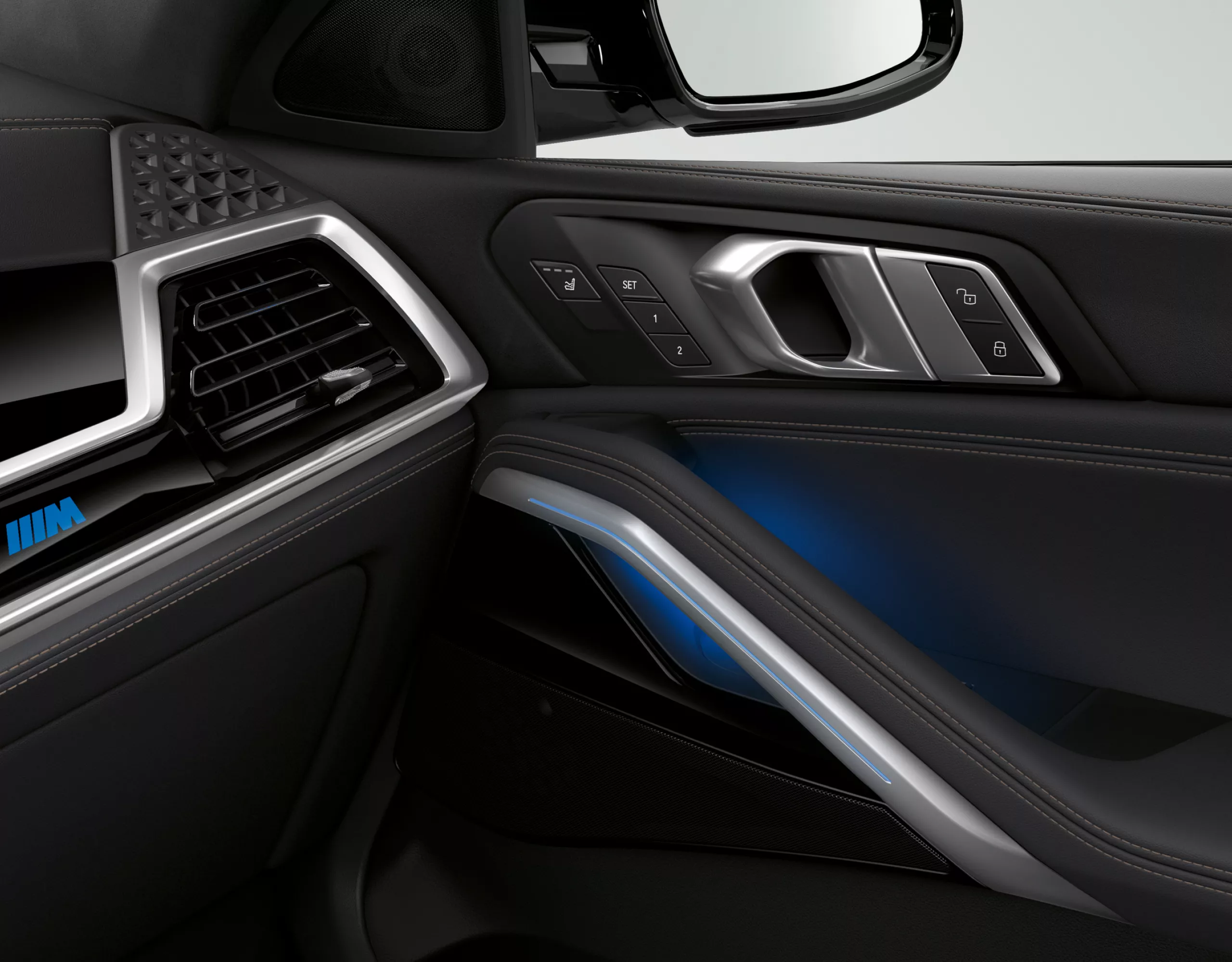 A speaker from the Bowers & Wilkins Diamond surround sound system in the BMW X6, showcased with the door and dashboard in view