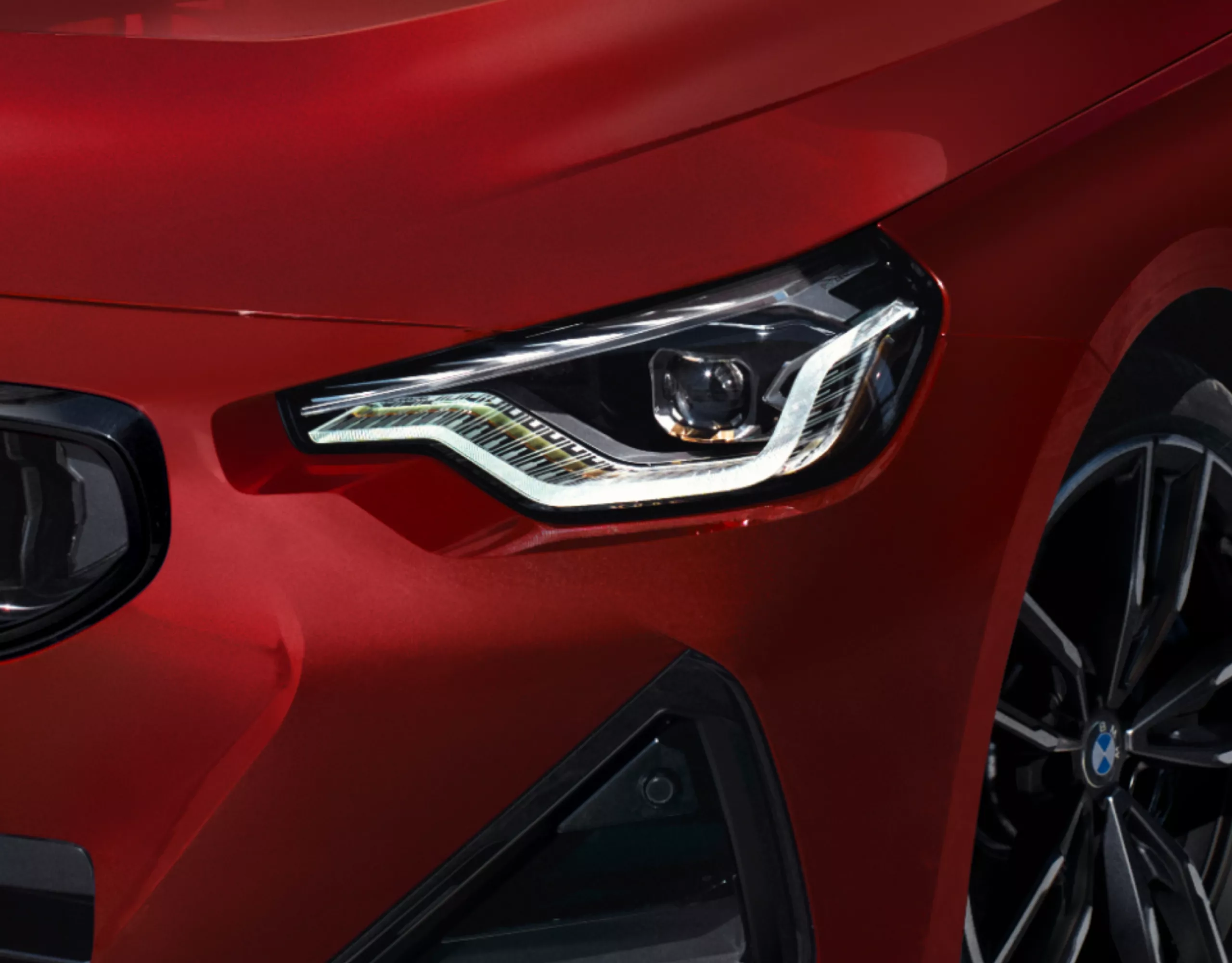 Bi-LED front headlights of a BMW 2 Series Coupé in close-up