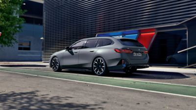 BMW i5 M60 xDrive Touring grey rear view 
