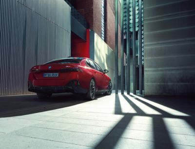 BMW i5 M60 xDrive red rear view 