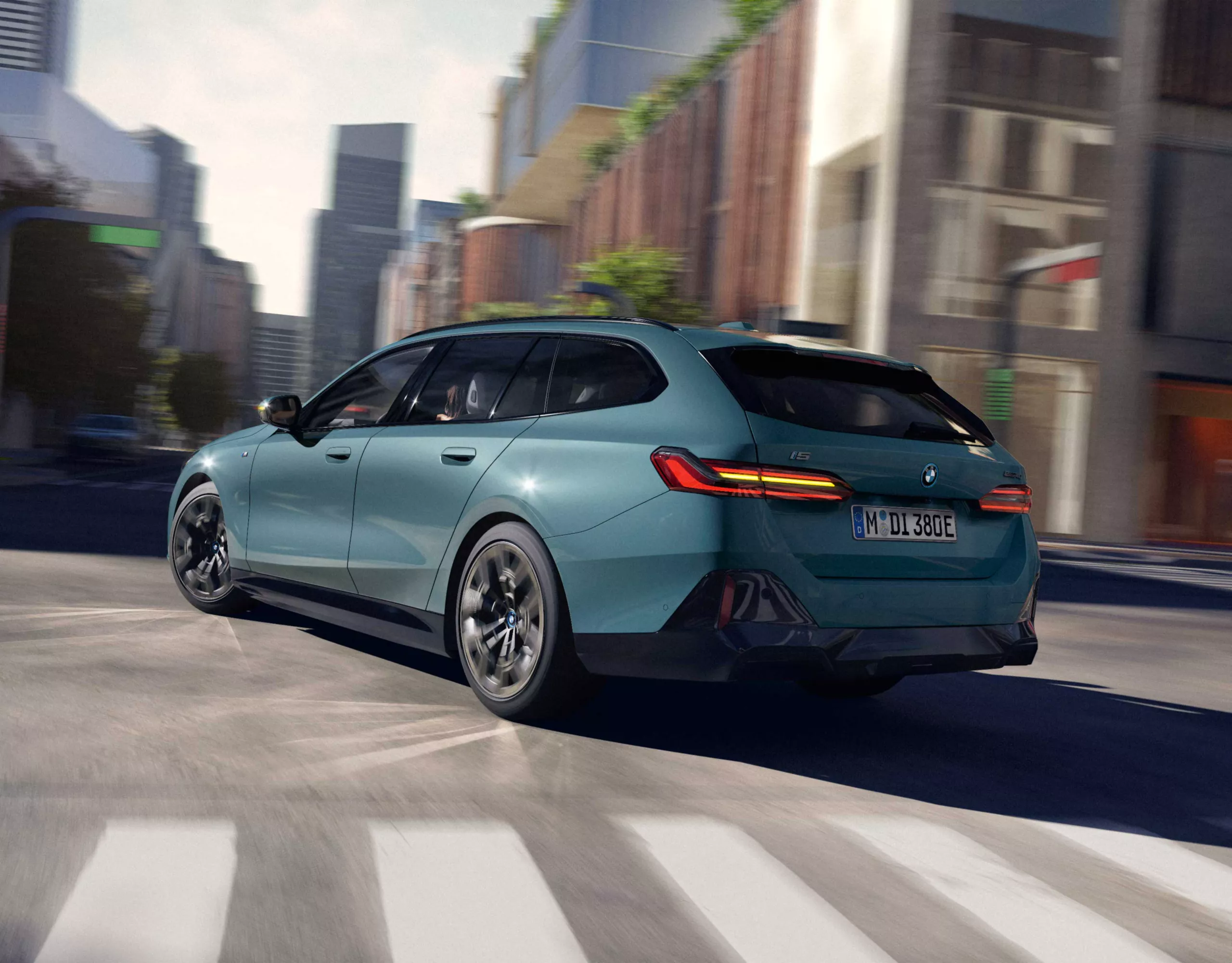 BMW i5 Touring green rear view