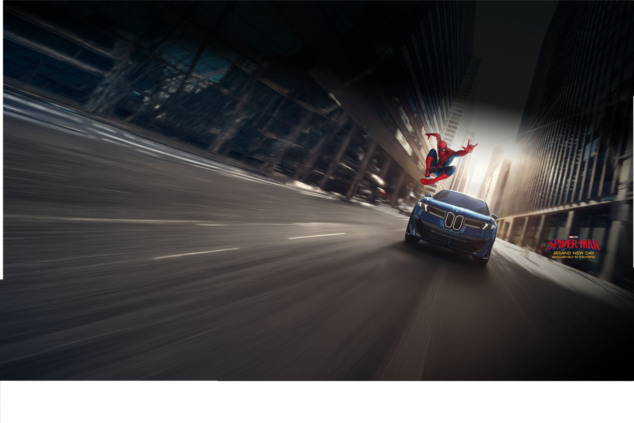Spiderman maneuvers in front of the iX3 as it zooms down a city street.
