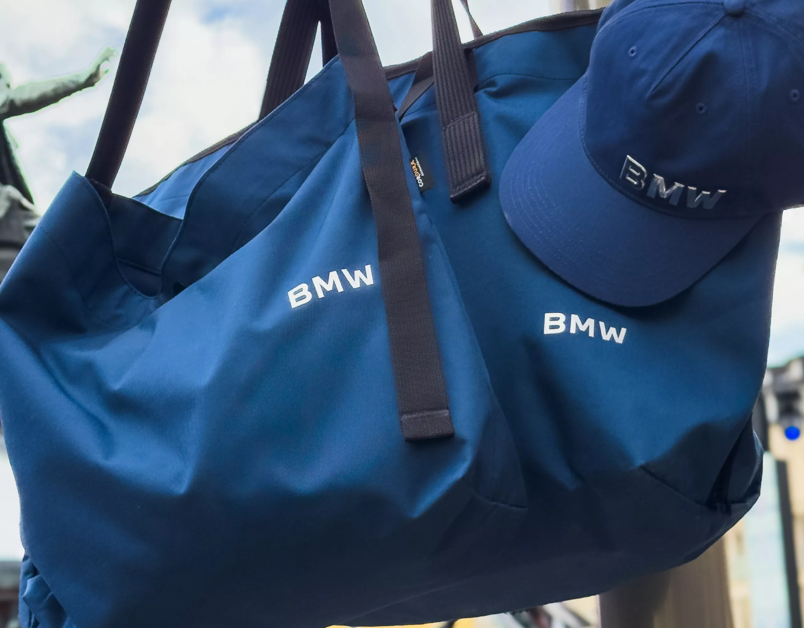 BMW Lifestyle large blue bag and blue baseball cap, both with BMW logo