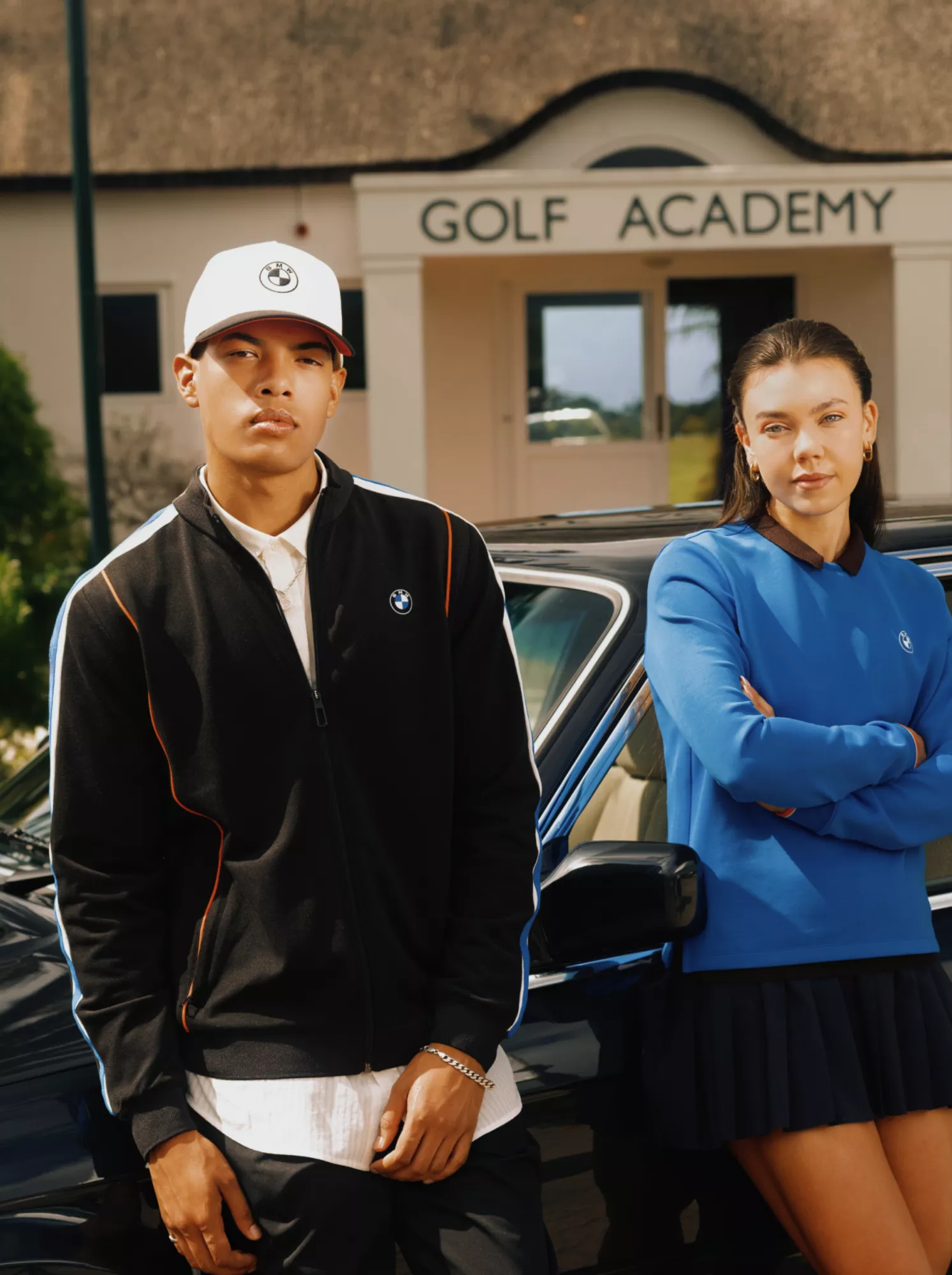 BMW Golf Collection jacket, baseball cap and shirt, worn by two young people