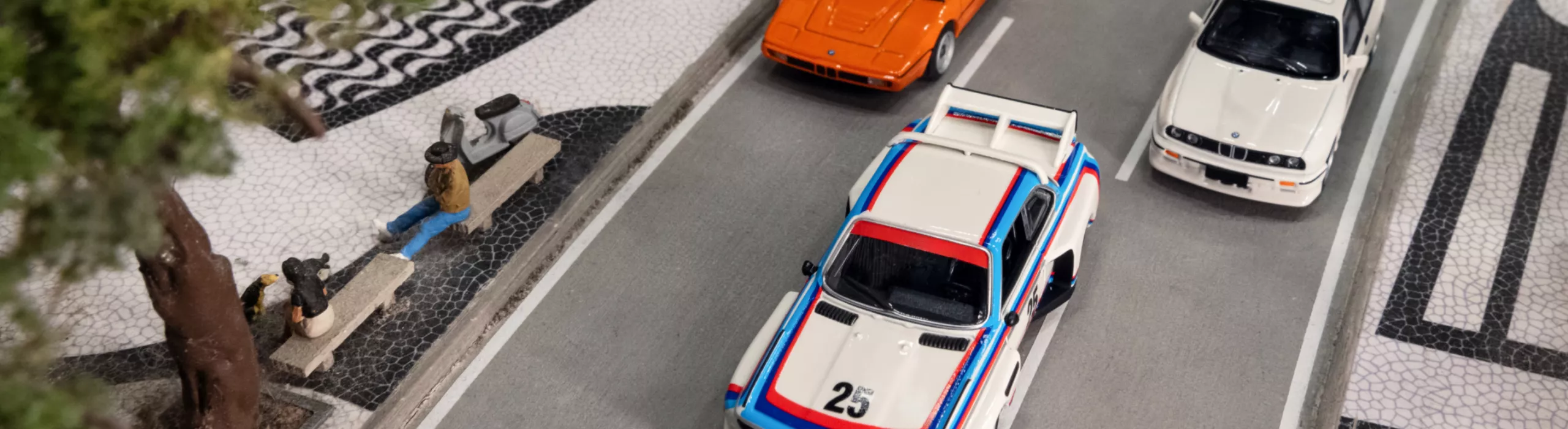 BMW Lifestyle BMW Miniatures featuring a BMW M3 E30, BMW M1, and BMW 3 Series E30 in a miniature setting 