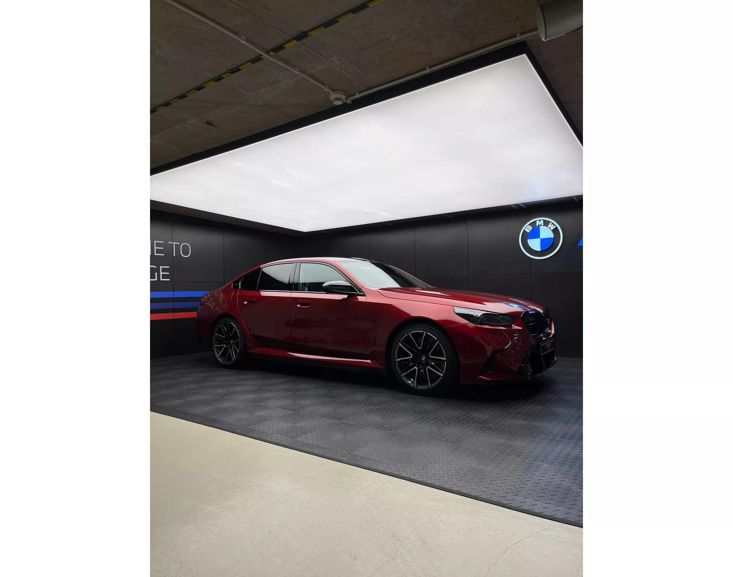 Red BMW in ///M garage. 