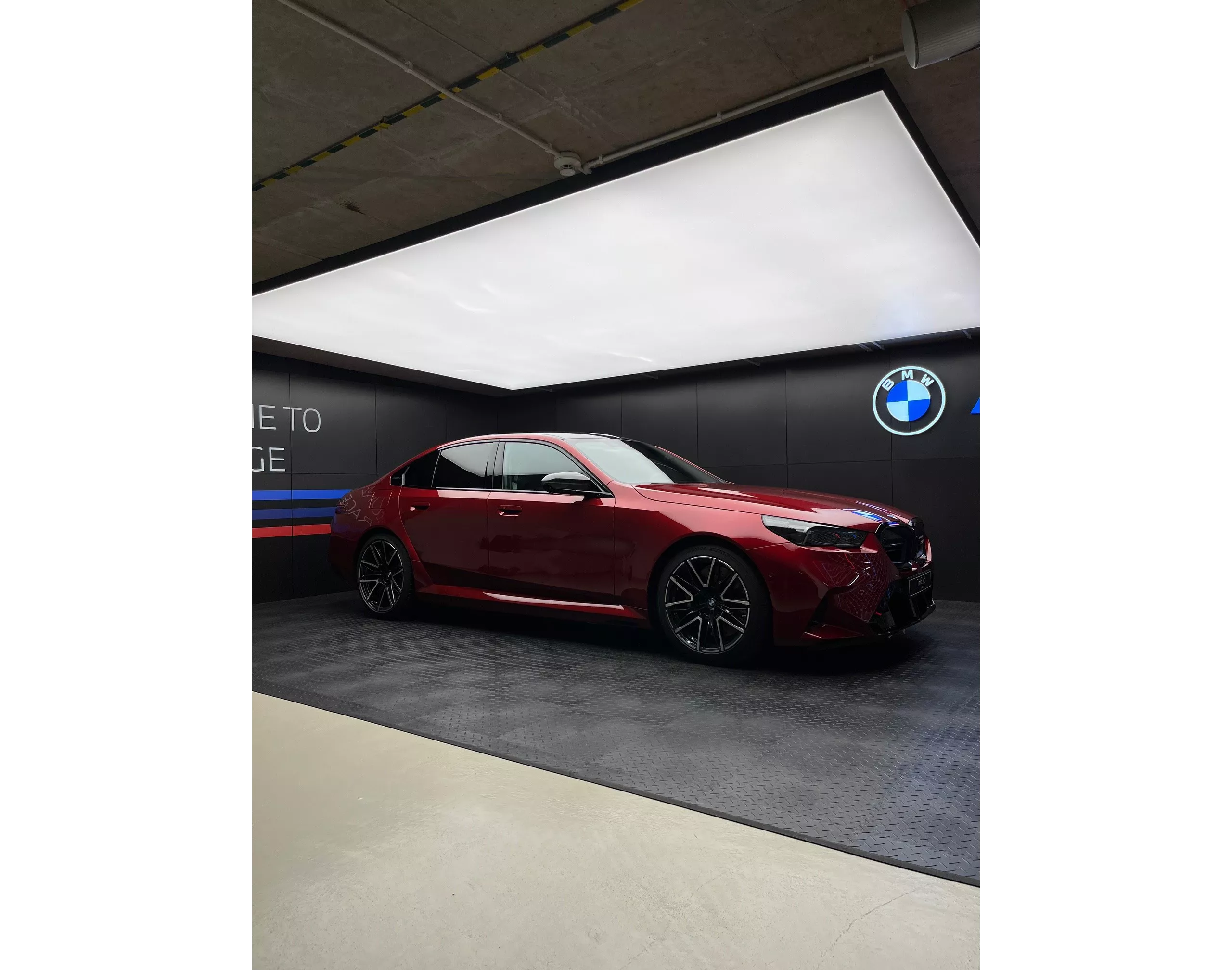 Red BMW in ///M garage. 