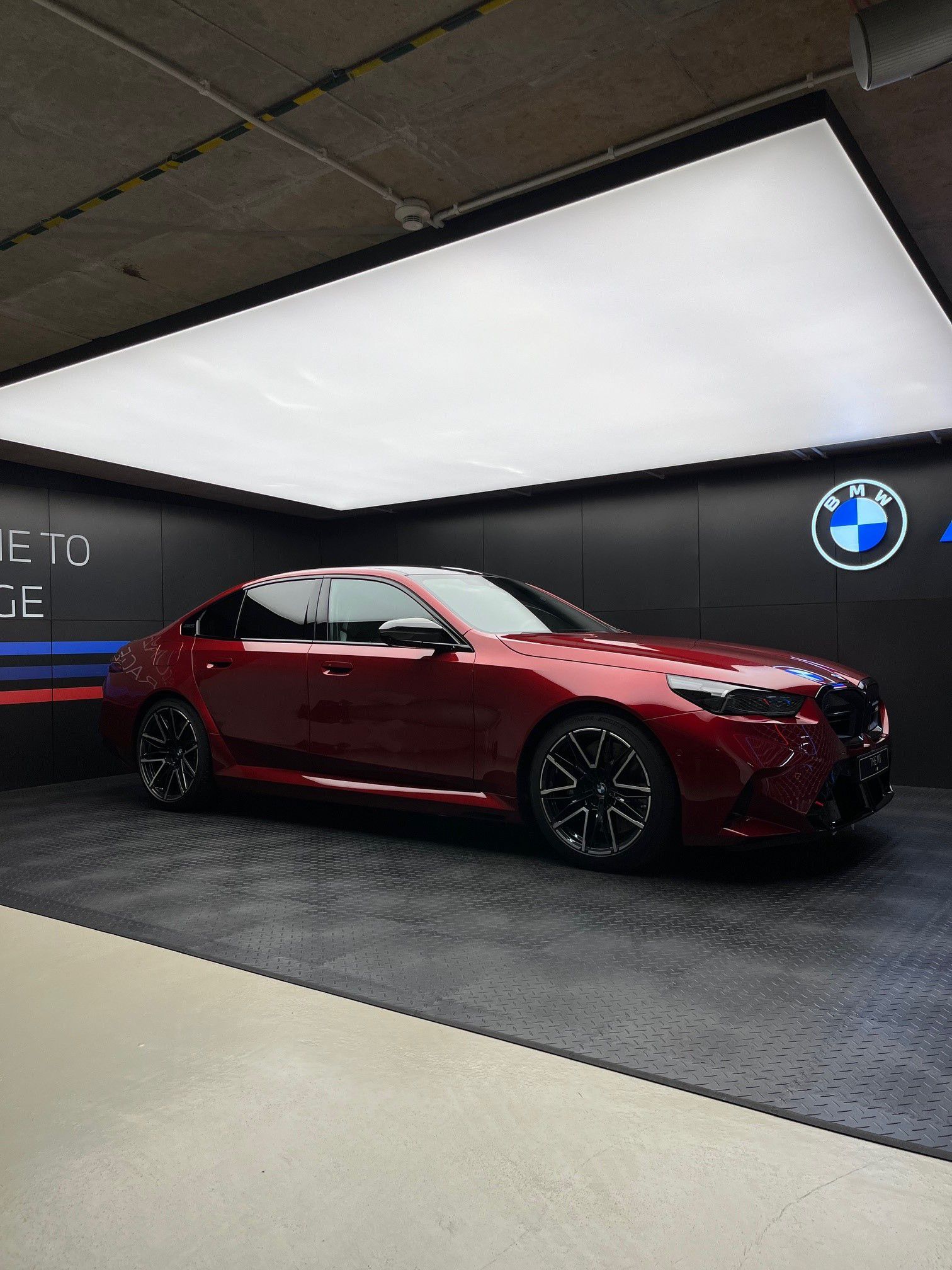 Red BMW in ///M garage. 