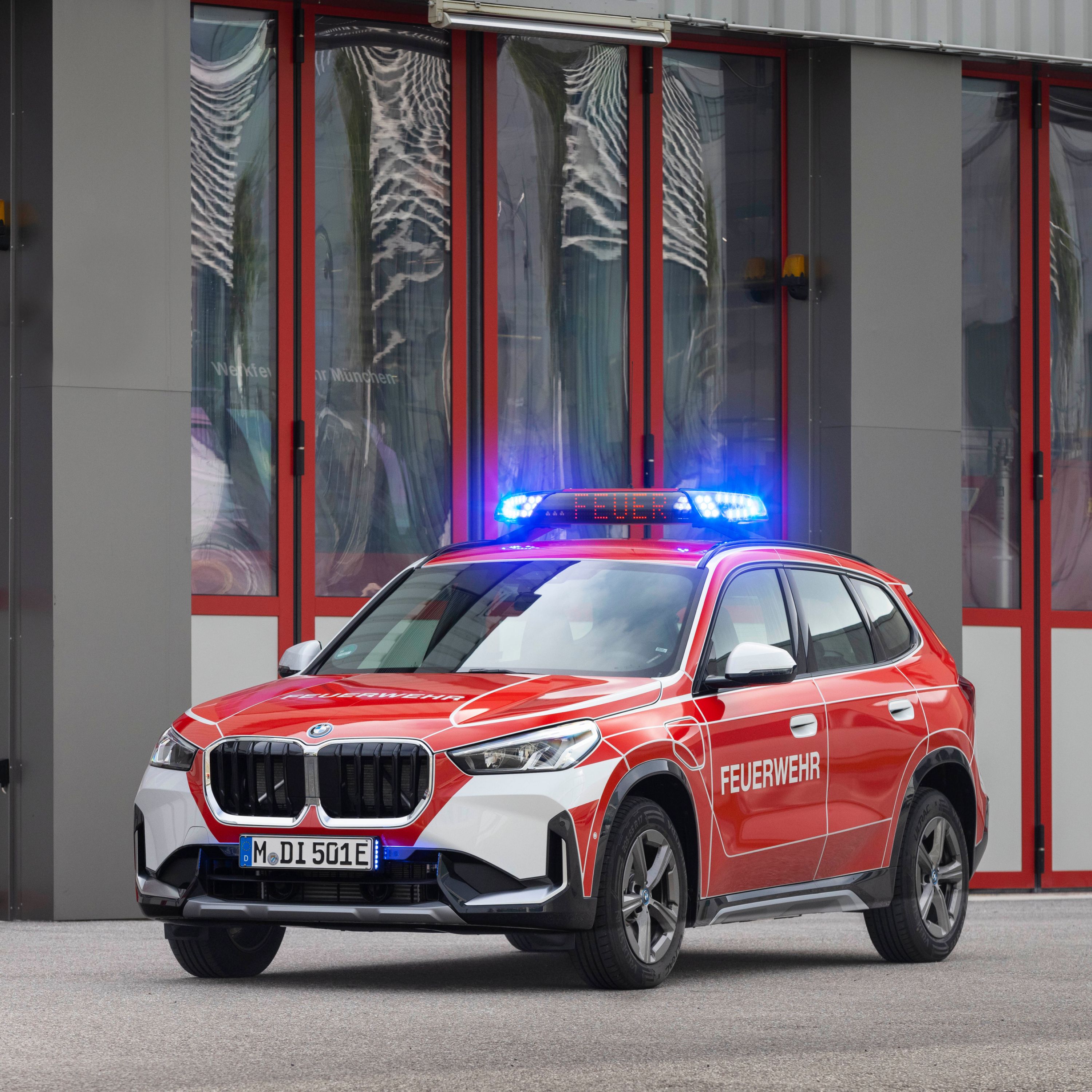 A BMW police vehicle in front of a building