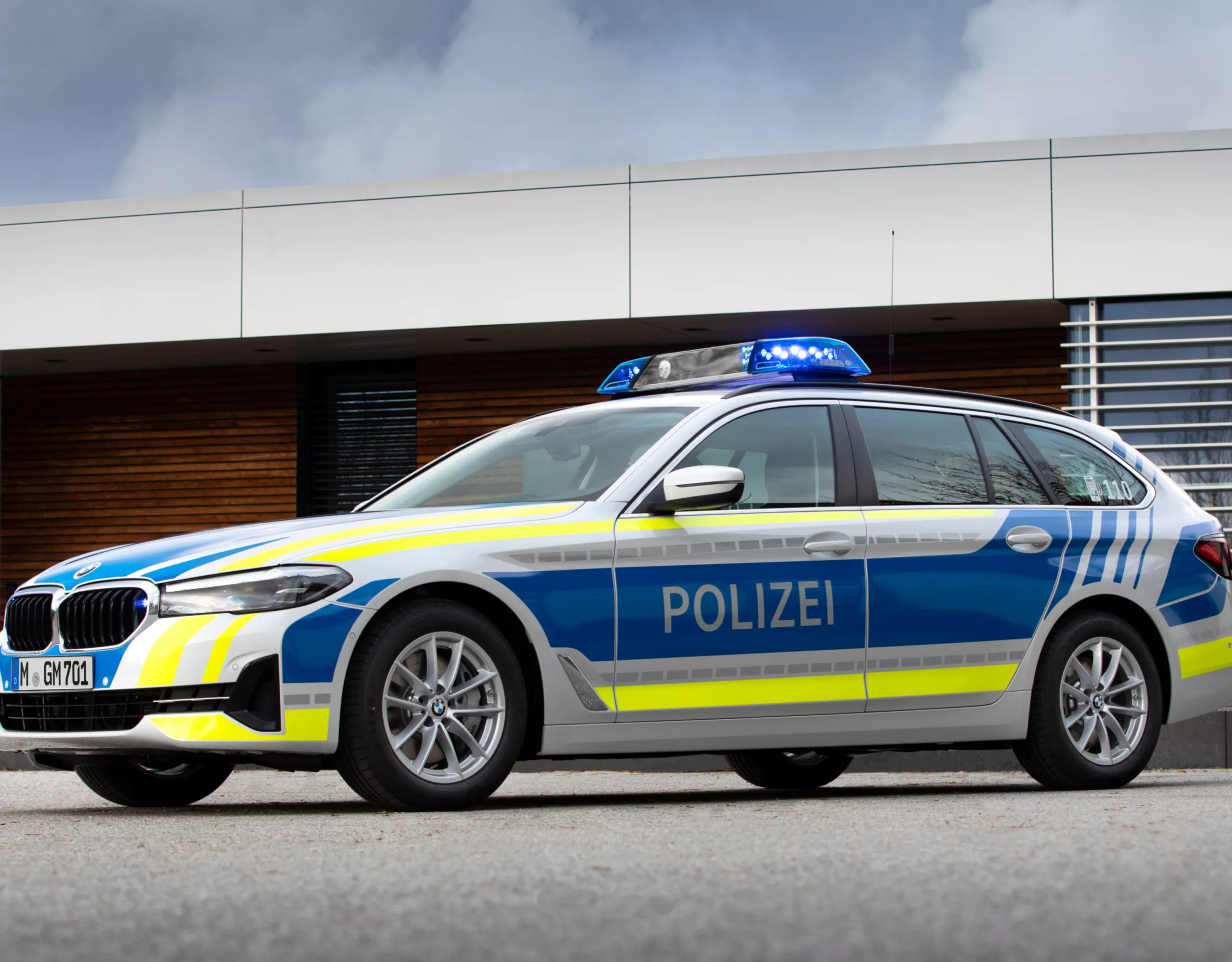A BMW police vehicle in front of a building