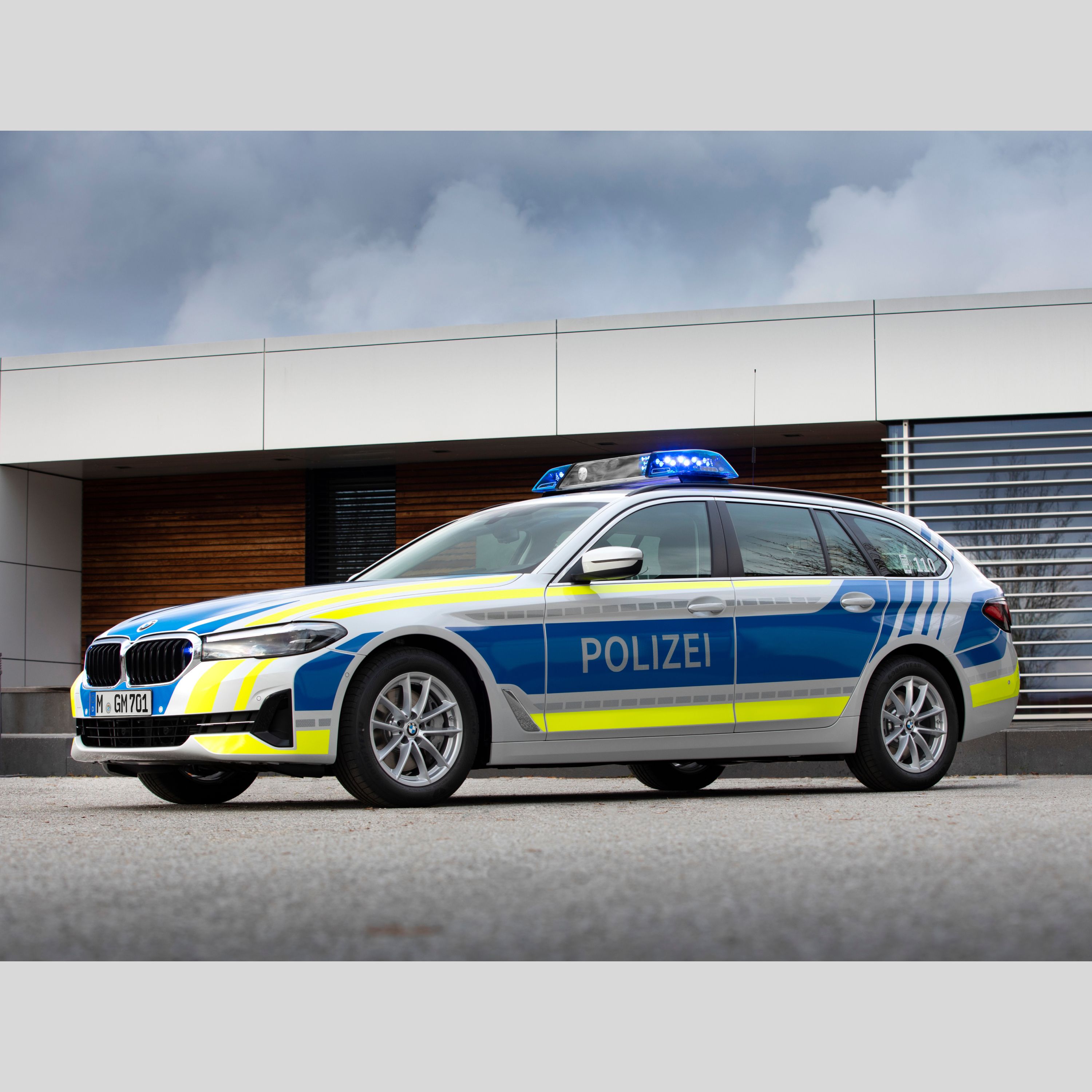 A BMW police vehicle in front of a building