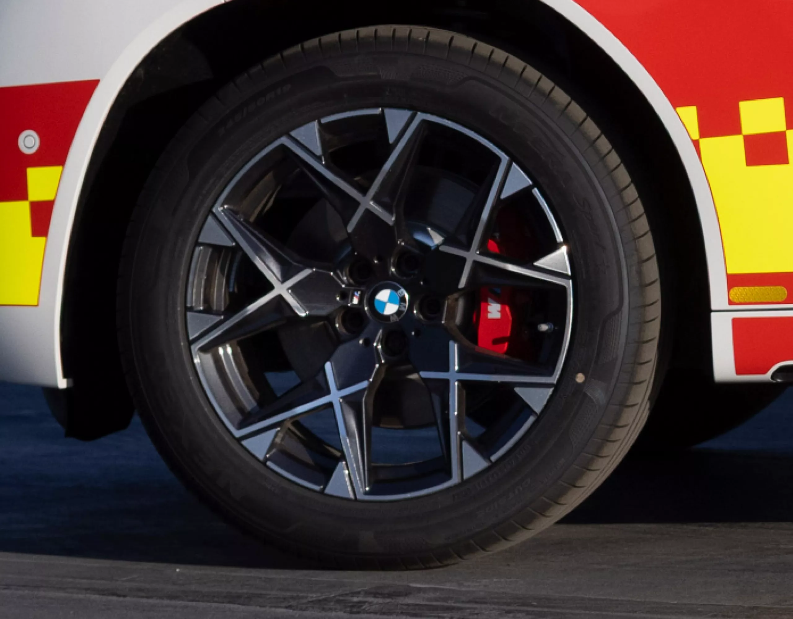 A close-up view of a BMW vehicle’s front wheel