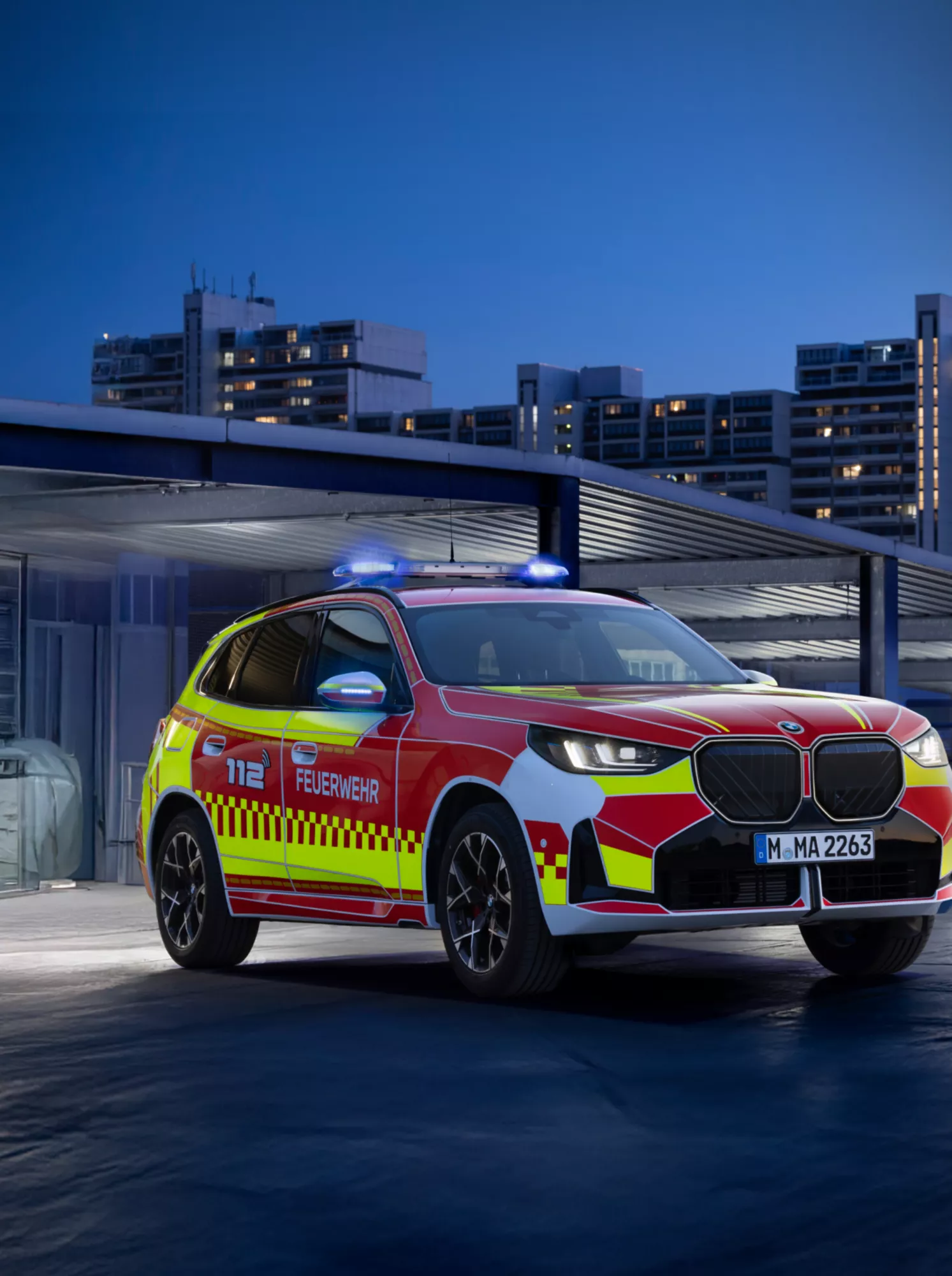 A BMW police vehicle in front of a building