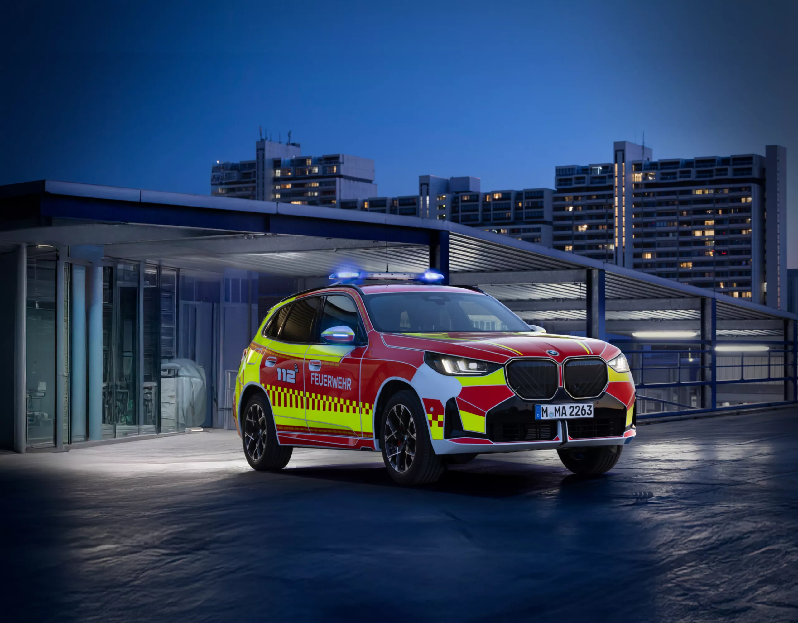 A BMW police vehicle in front of a building
