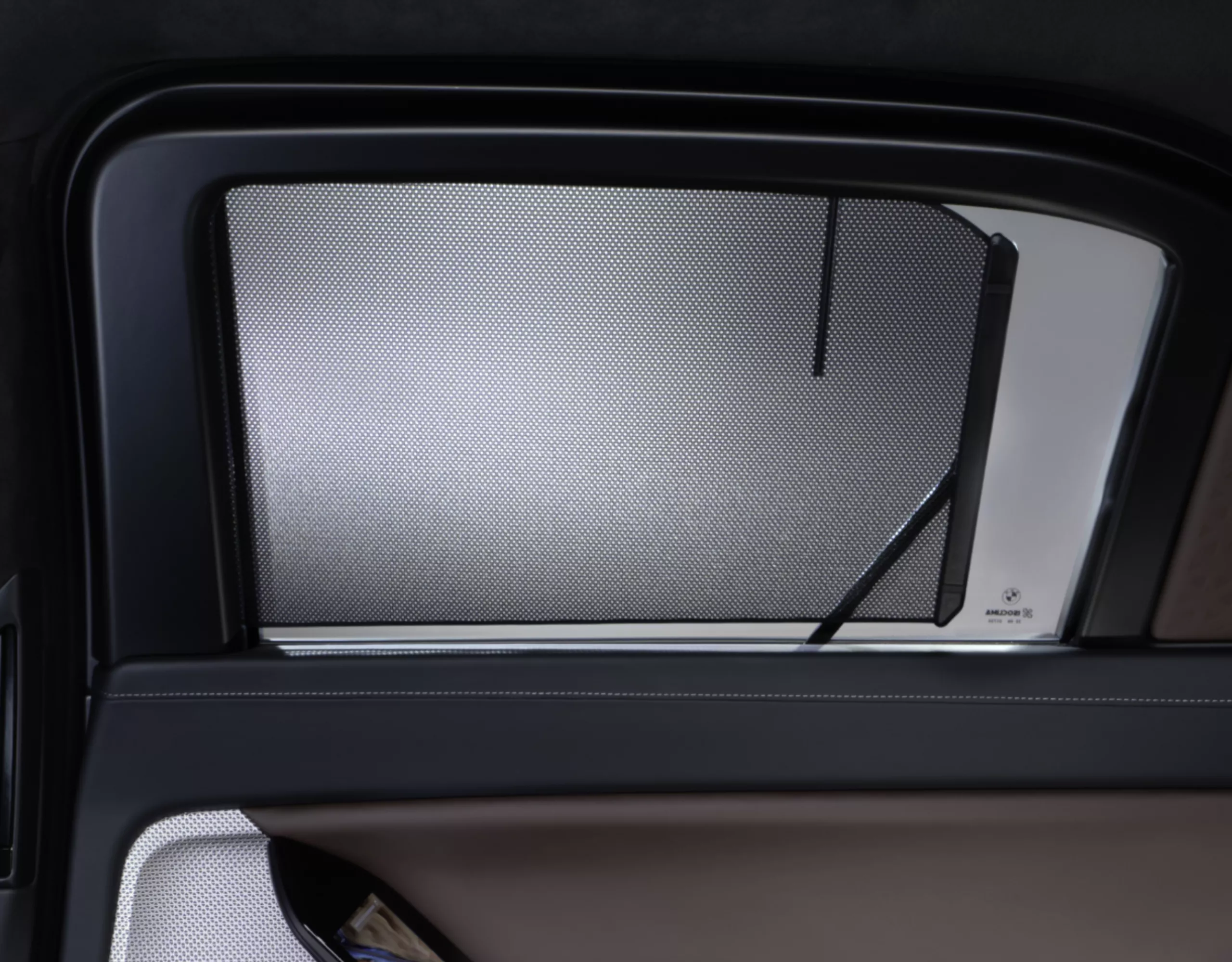 Interior close-up of a BMW with roller sunblind
