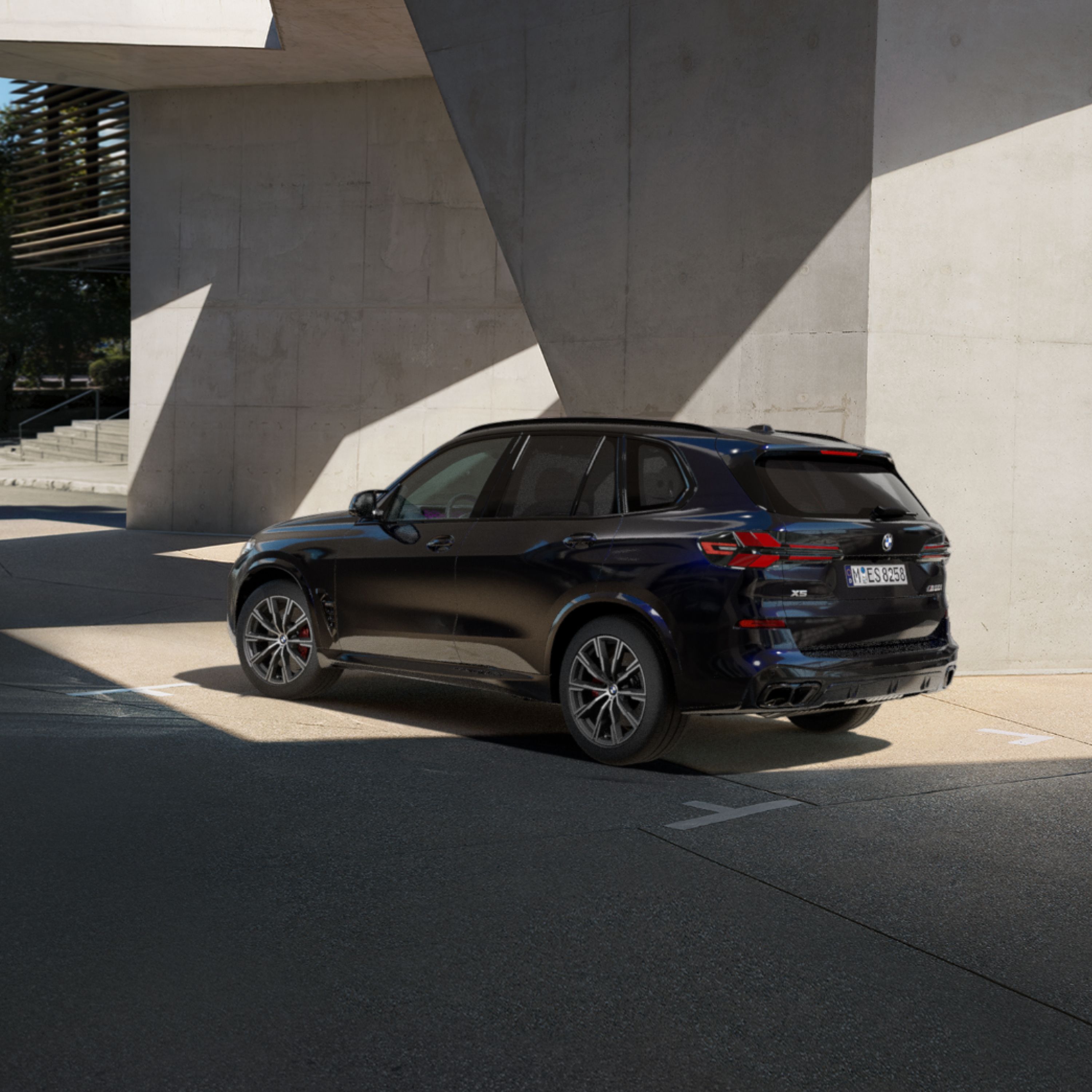 A BMW Protection Vehicle parked next to a concrete wall