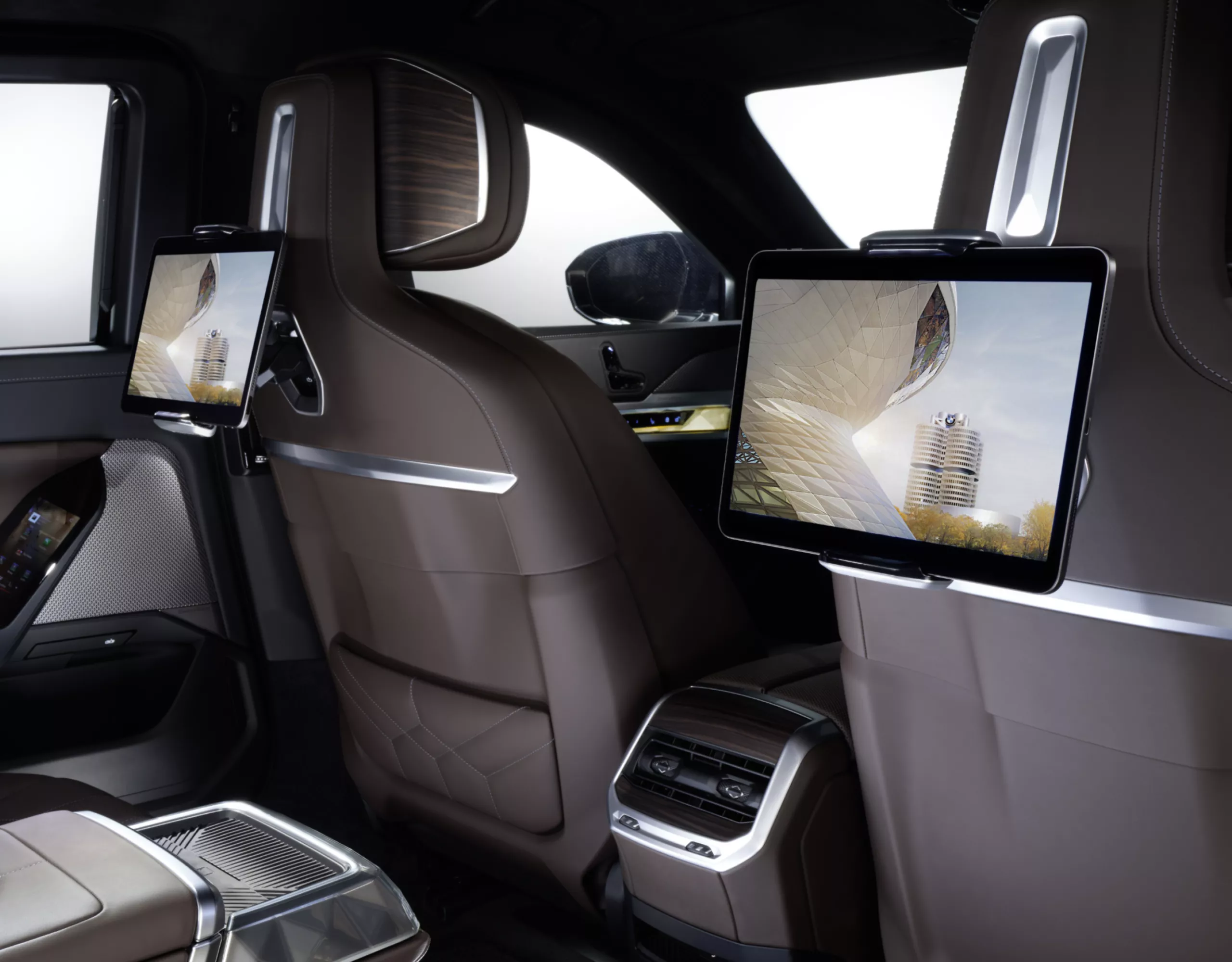 BMW inside view of the rear row of seats with tablets on the back of the front seats