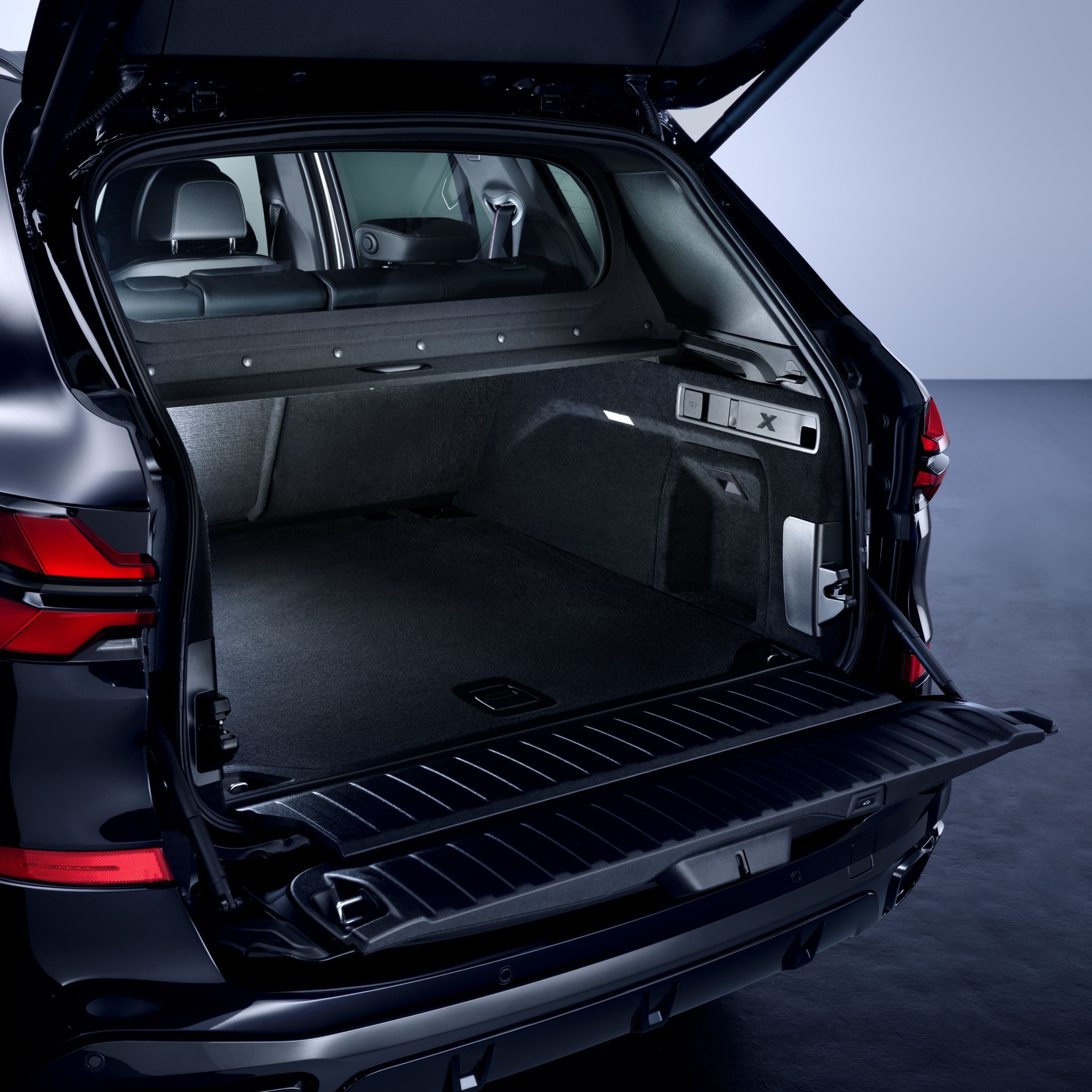 Close-up of the open tailgate of a BMW Protection Vehicle with a view into the passenger cell