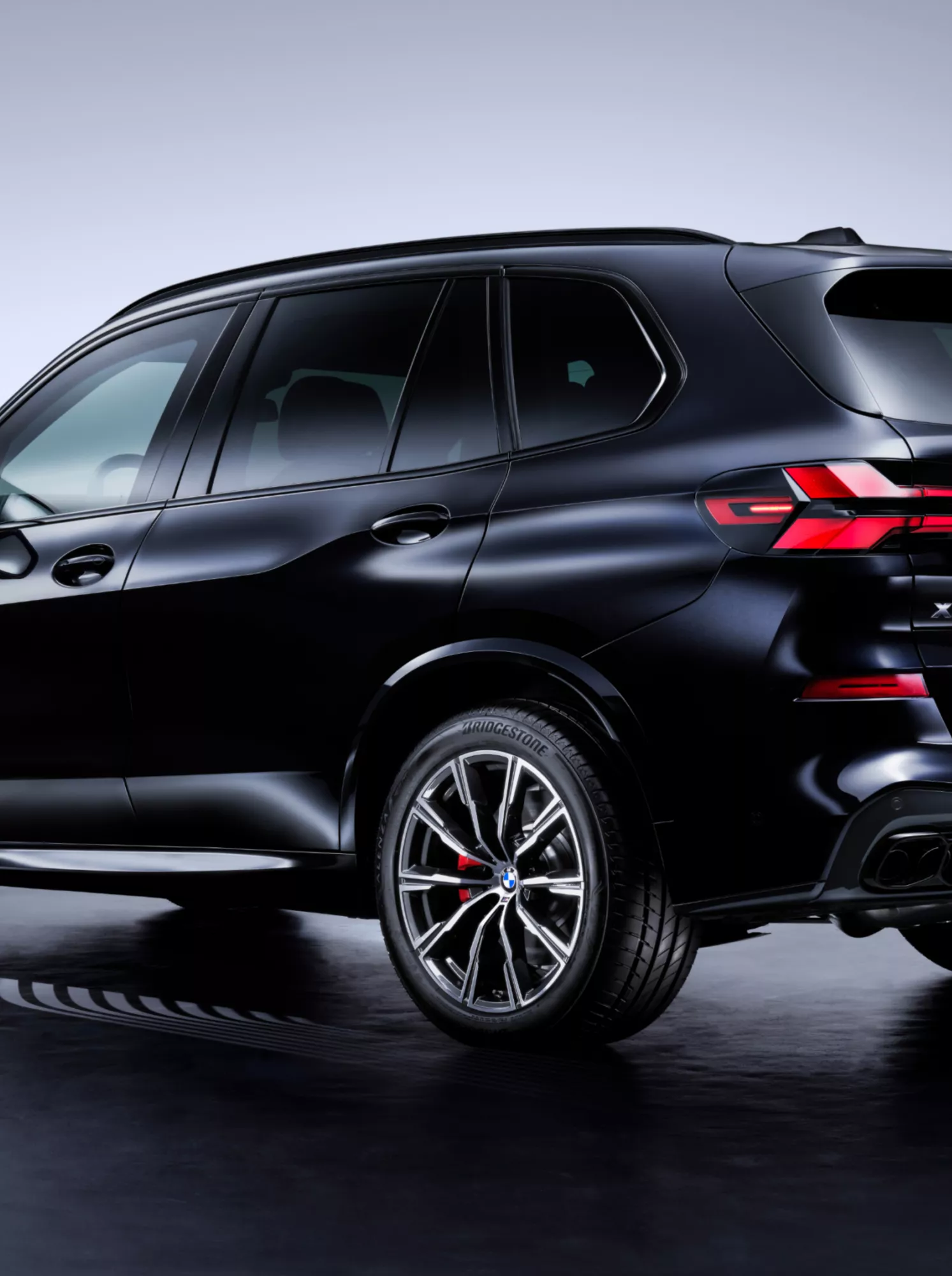 A BMW SUV Protection Vehicle with three-quarters of the side seen from the rear