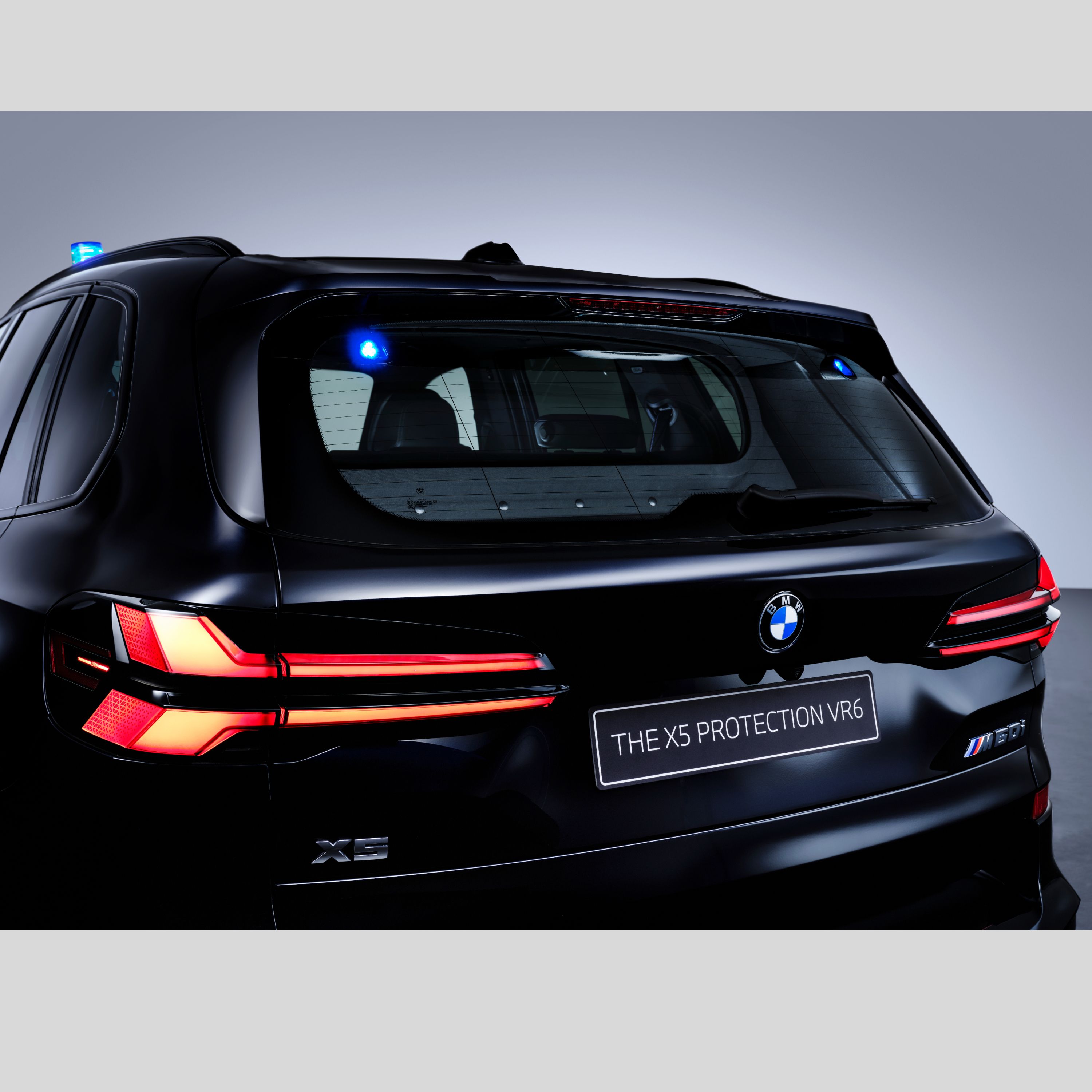 Rear of a Protection Vehicle with two additional blue flashing lights at the top right and left of the rear window