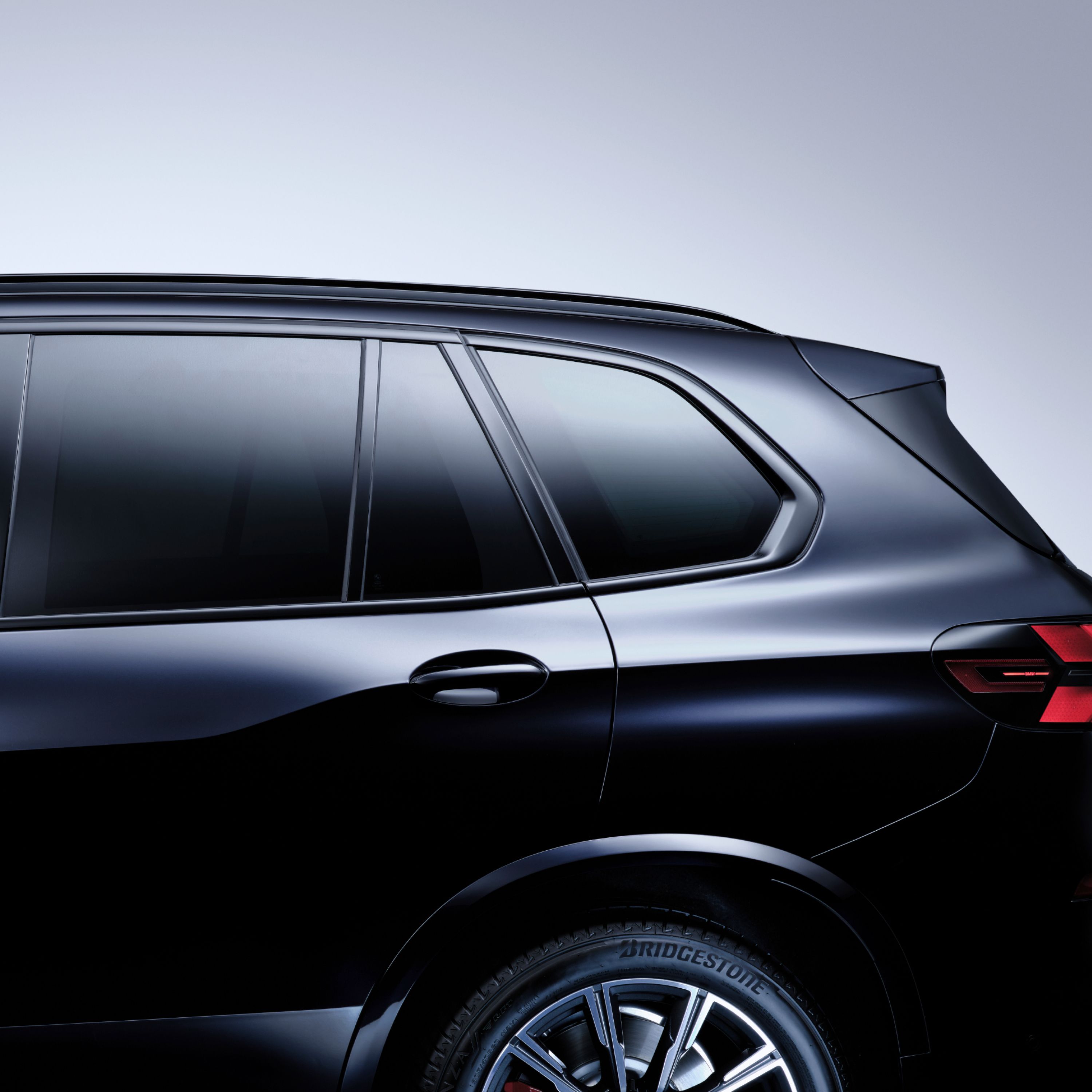 Close-up of the rear left window of a BMW with sun protection glazing