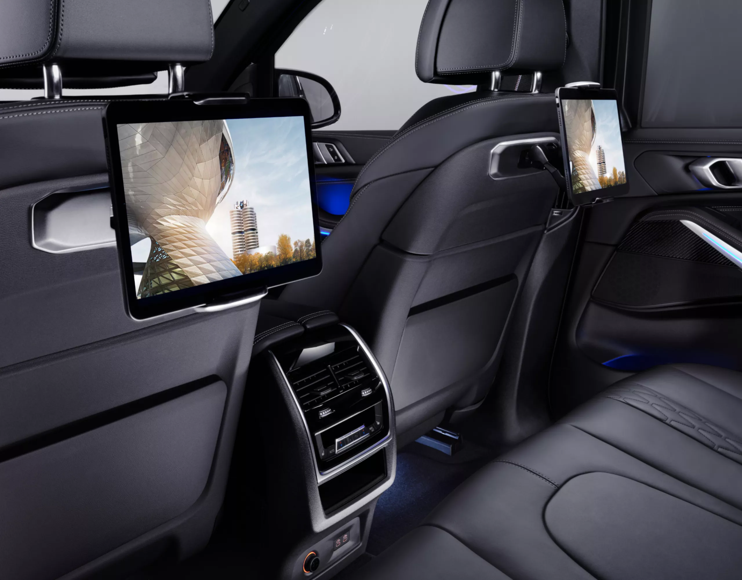 BMW inside view of the rear row of seats with tablets on the back of the front seats
