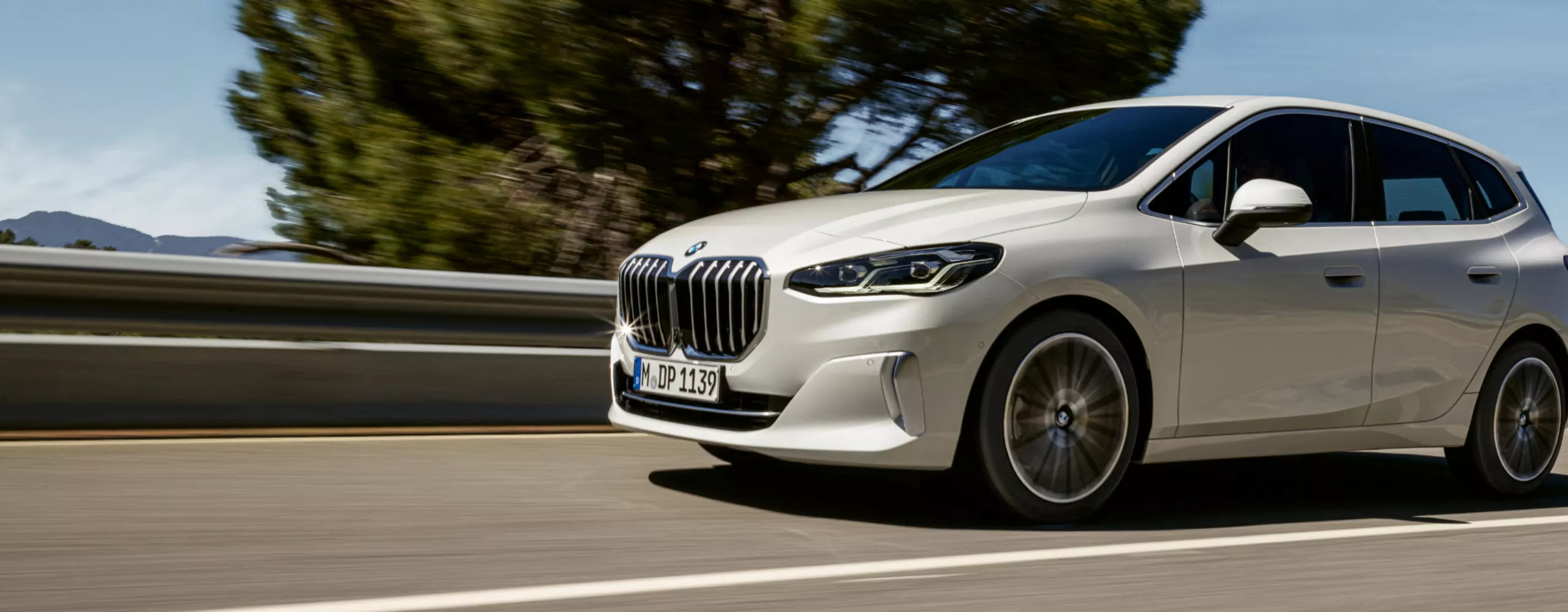 BMW 2 Series Active Tourer driving on a road with a guard rail